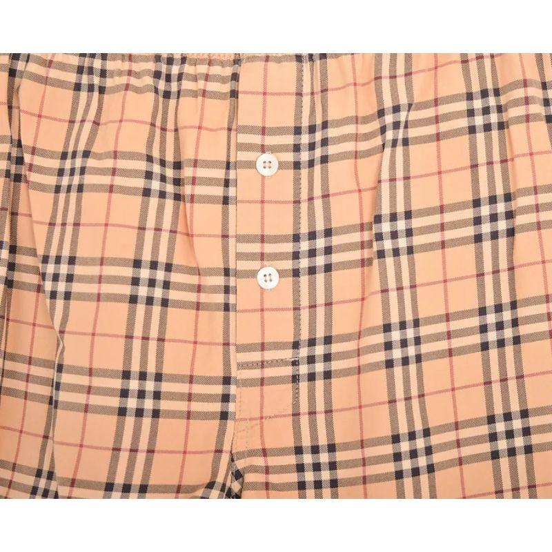 Iconic 2000's BURBERRY Nova check Cotton boxer shorts. 

Features:
Elasticated waist band
x2 Central line buttons
Loose fitting
100% Cotton
Sizing: Waist: 30'' - 34'' (elasticated)
Recommended Size: 30'' - 34'' (elasticated)
Condition 6/10. Slight