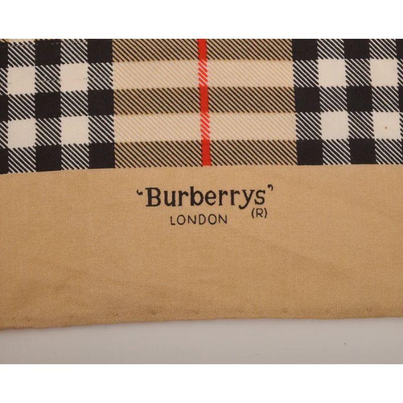Iconic 1990's Burberry Silk pocket square by Burberry of London. 

Features:
Nova check print
Hand rolled hems
100% Silk
Sizing: Approximately 18'' x 18''
Condition 9/10. A single, very minor mark.