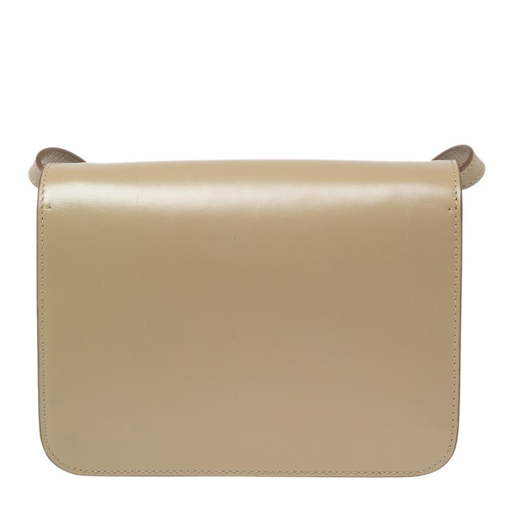 Burberry's nude TB leather shoulder bag is a knowing investment piece that's on-trend now too. It's finished with an elegant metal TB clasp as well as an adjustable shoulder strap so it can be worn in a number of ways. Carry it with everyday