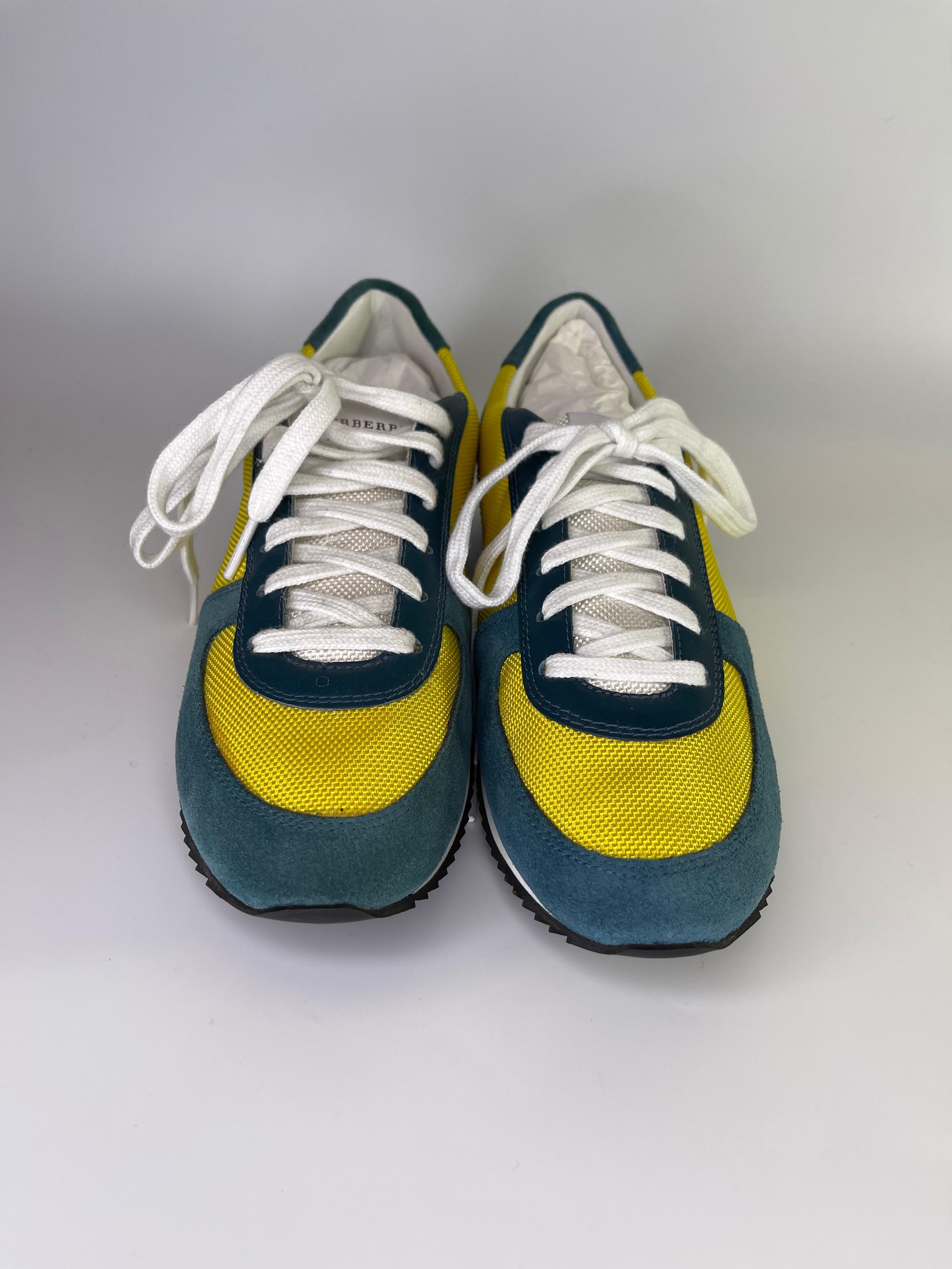 These Burberry runners feature University of Michigan colors blue and yellow. Perfect for Ann Arbor Students! They are made with yellow nylon and blue suede with contrasting white shoe laces. 

COLOR: Blue/yellow
MATERIAL: Nylon/suede
ITEM CODE: