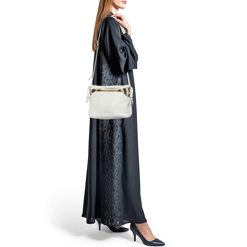 Express your personal style with this high end crossbody bag. Crafted from quality materials it has been added with fine details and is finished perfectly. It features a well sized interior.