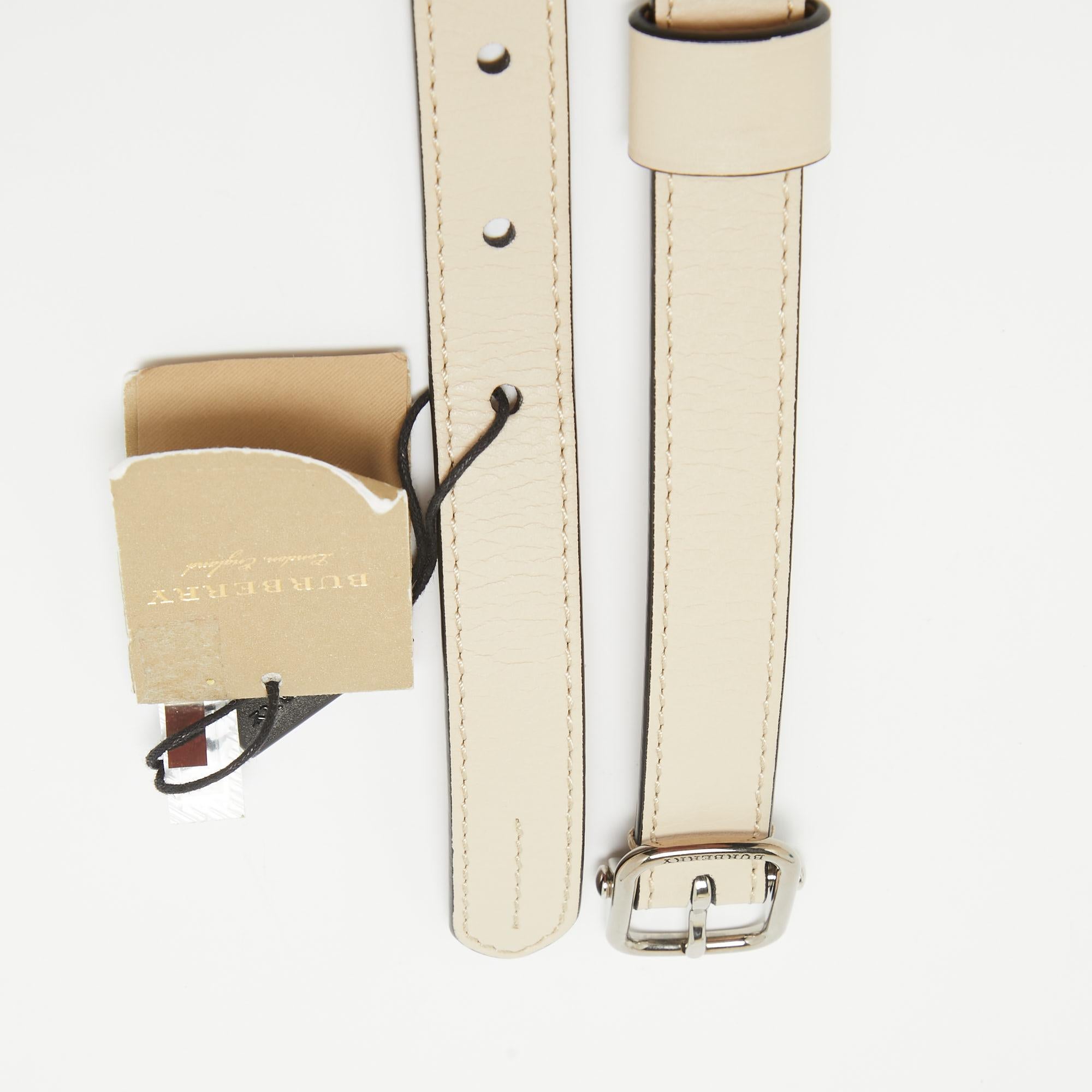 Statement belts for women are essential accessories for creating unique and distinctive looks. One such belt is this Burberry creation that comes crafted from leather in a lovely off-white shade. It is adorned with crystal-embellished daisy motifs