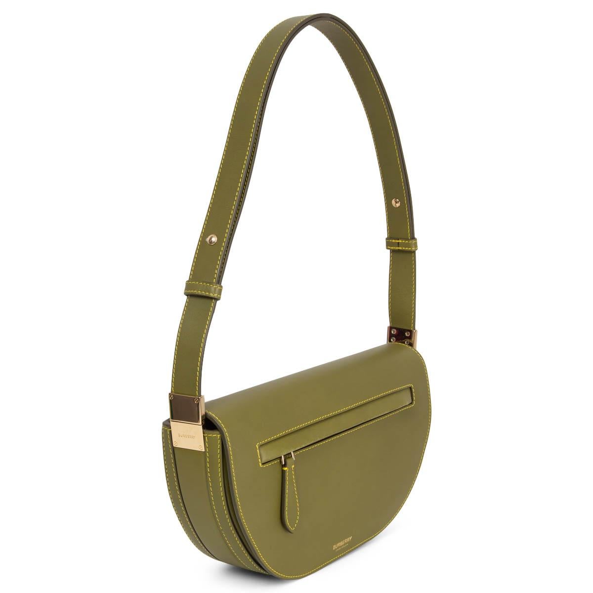 100% authentic Burberry Small Olympia Shoulder Bag in olive green smooth leather. The modified demi-lune silhouette and streamlined detailing lend a sleek look to this bag with gold-tone hardware and contrasting yellow stitching. Opens with a hidden
