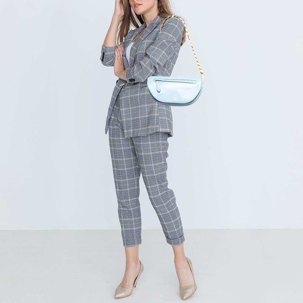 Indulge in luxury with this Burberry pale blue bag. Meticulously crafted from premium materials it combines exquisite design impeccable craftsmanship and timeless elegance. Elevate your style with this fashion accessory.