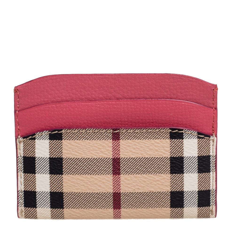 This stylish and functional cardholder by Burberry is a must-have. It is equipped with multiple, well-lined slots to hold your cards and decorated with signature Haymarket checks.

Includes: Original Dustbag, Brand Tag
