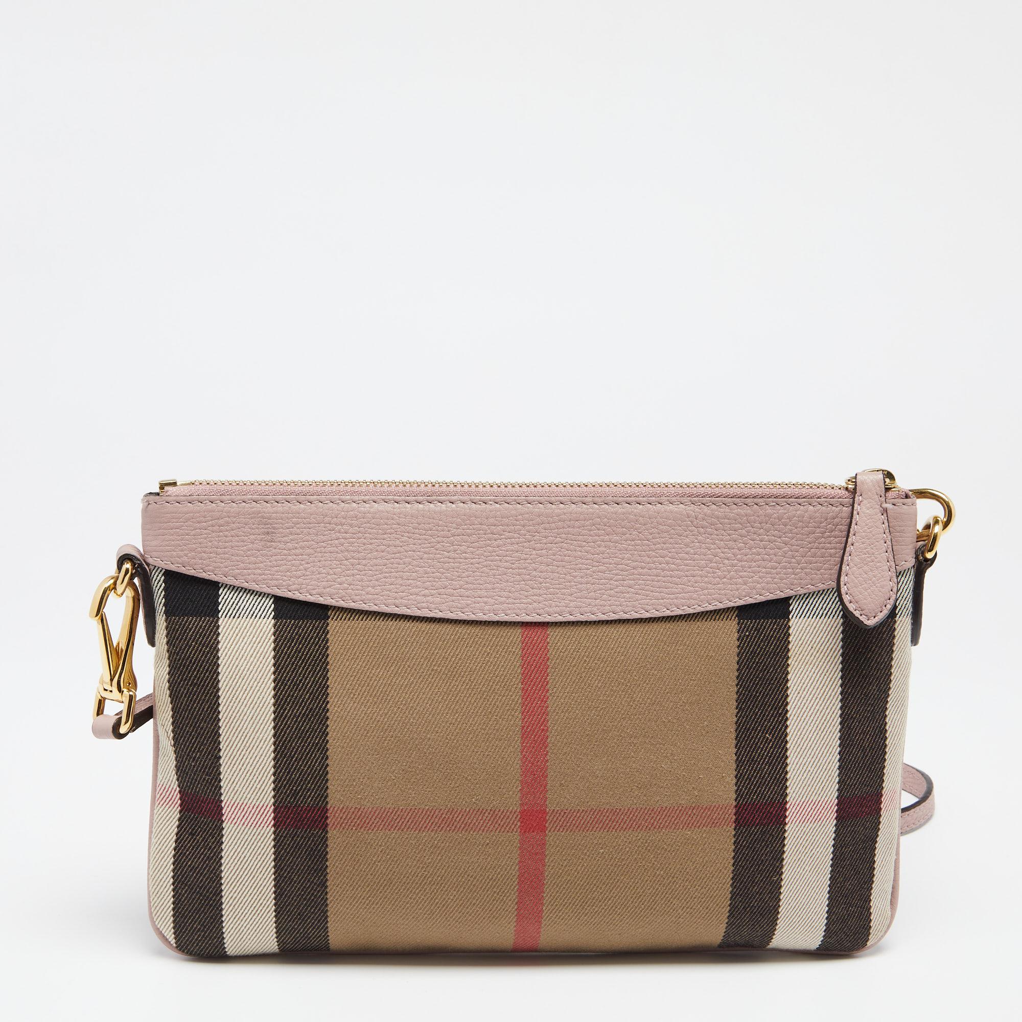Crafted from signature canvas with leather trims, this Burberry Peyton bag is a valuable and reliable accessory. It features the brand signature on the front, gold-tone hardware, and a shoulder strap. Lined with canvas, the interior is spacious