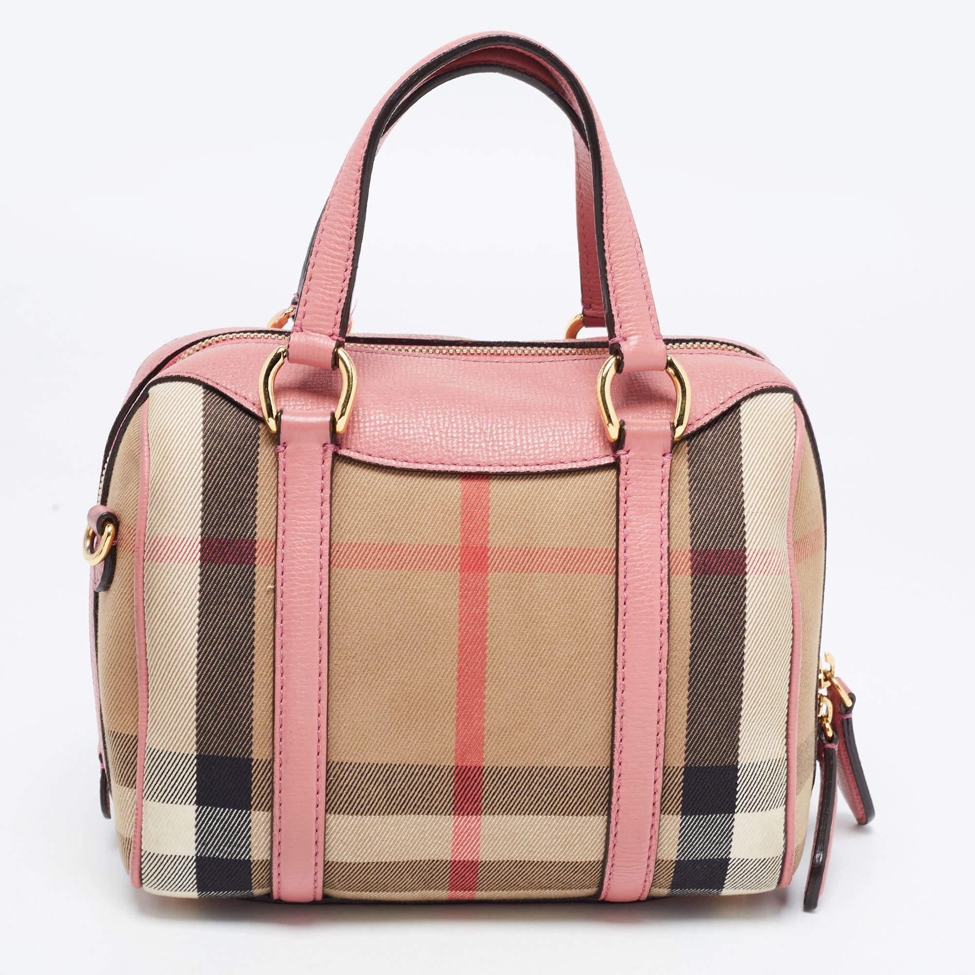 Known for unmatchable quality, Burberry's bags make great daily companions. Hence, this smart and pretty Bowler bag is not only an attractive accessory that will elevate your look but is also spacious enough to hold all your everyday