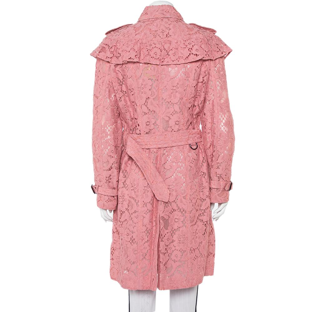 This Stanhill creation from Burberry is beautifully tailored into a trench coat. It brings a charming pink to a design that is modern yet timeless. Sheer lace is used to form the entire coat while long sleeves, pockets, and a belt add the most