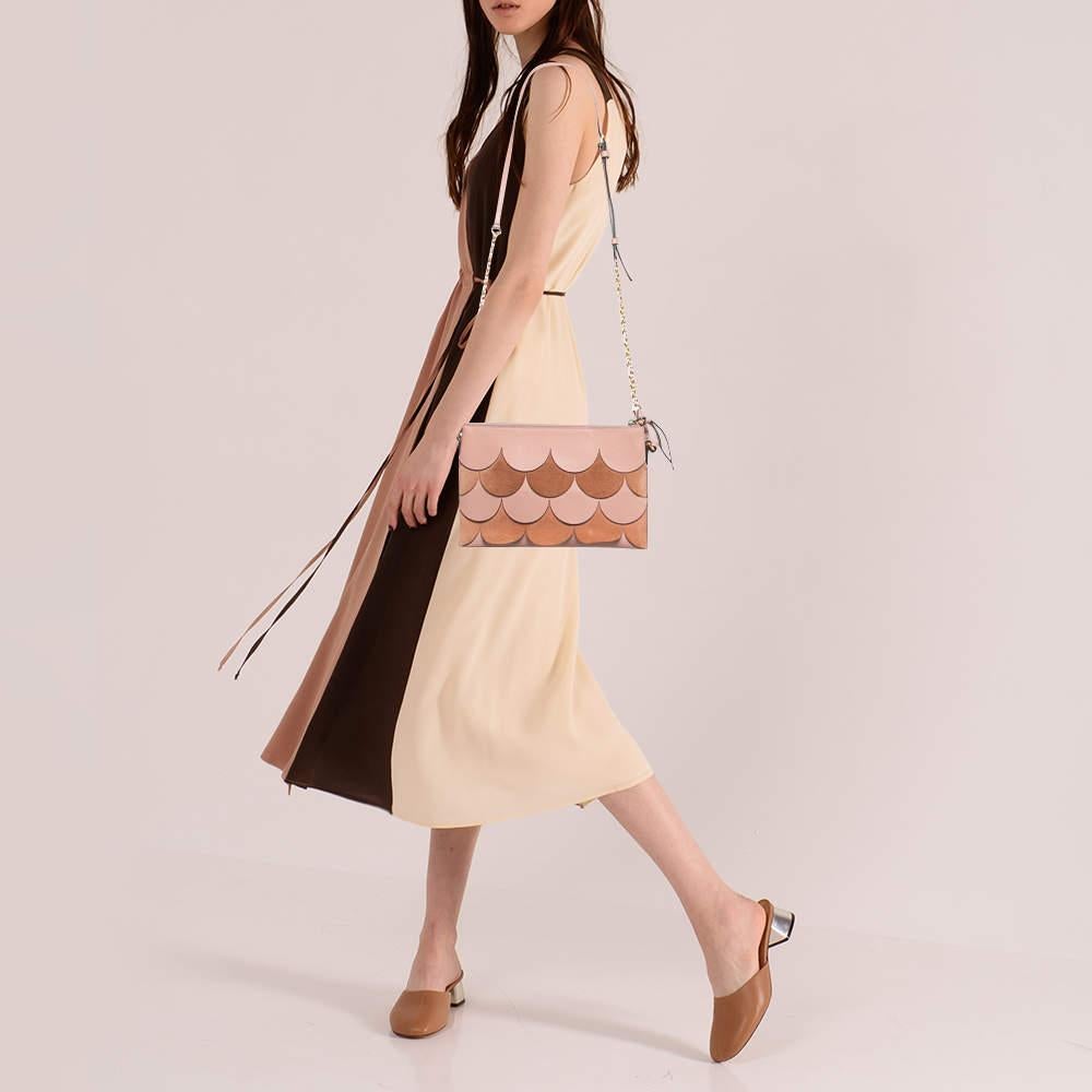 This crossbody bag by Burberry is an ideal option for keeping your daily essentials safe. Made from pink suede and leather  this bag is handy and lightweight. The Peyton has a zipped fabric compartment sized to store all your essentials and is