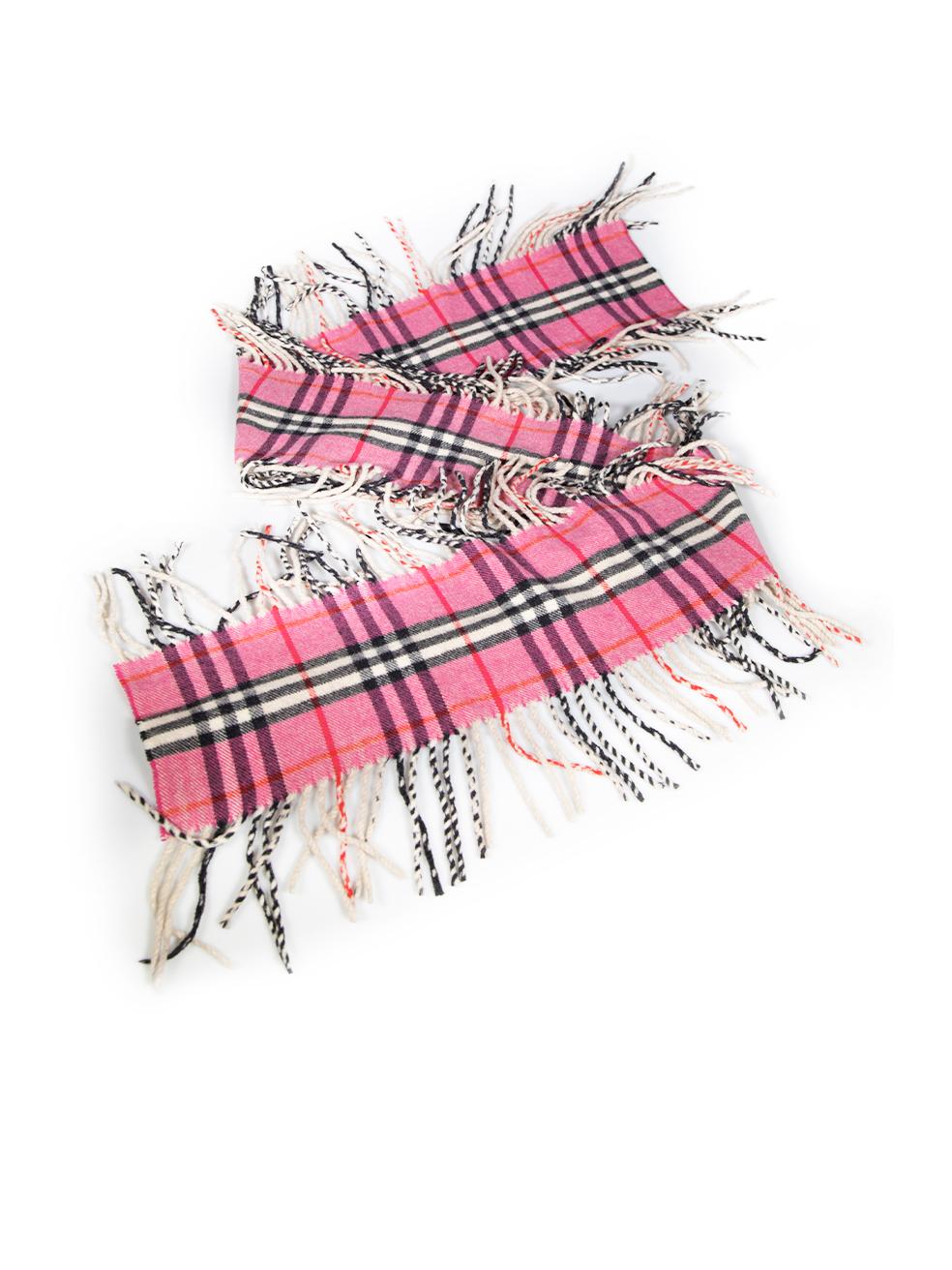 CONDITION is Good. General wear to scarf is evident. Moderate signs of wear to the knit with a small discoloured mark found near one end, a small tear at the edge and some of the fringing has partially unravelled on this used Burberry designer