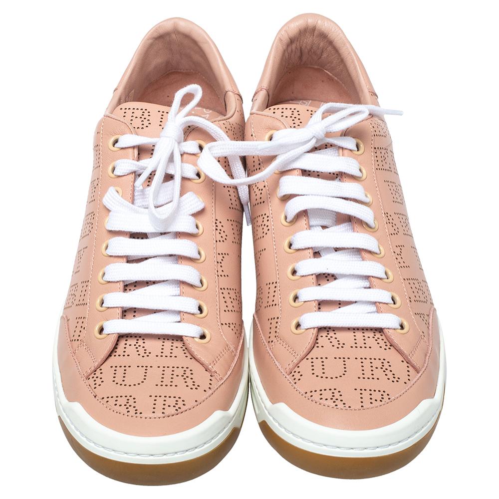 These Burberry sneakers are ideal for lending a stylish appeal to your casual outfits. Made from leather with perforated details, they feature the brand's logo allover and have a lace-up front, leather insoles, and durable rubber soles.

Includes: