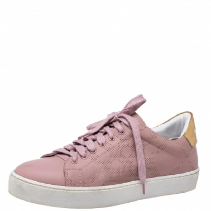 The Westford sneakers carry Burberry's signature checks in a perforated pattern. They are crafted from leather in a low-top silhouette and feature the brand name on the counters. A sturdy built, lace-up on the vamps and leather insoles make this