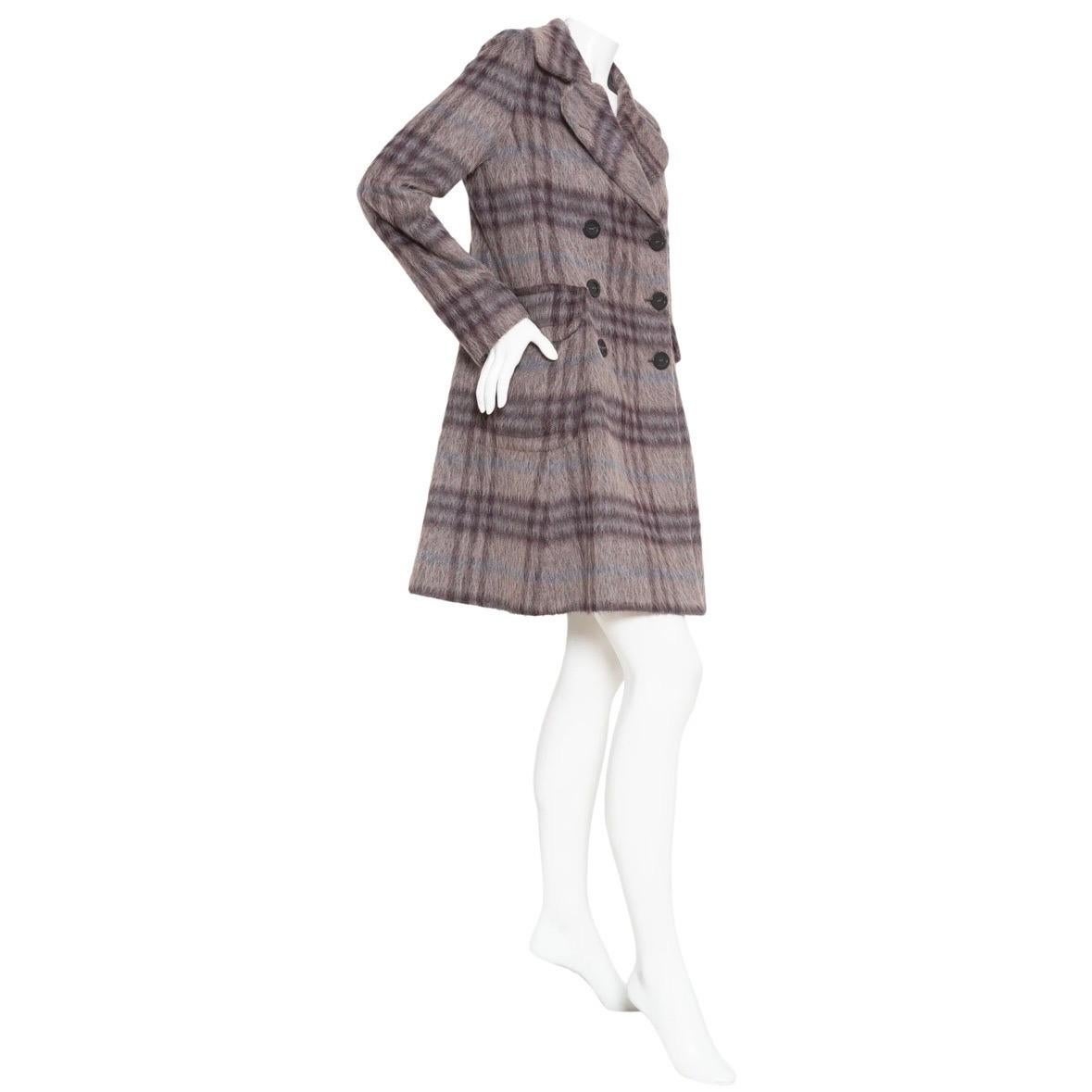 Burberry Plaid Print Trench Coat

Purple/Gray/Blue/Beige
A-line silhouette
Notched collar
Flap pockets
Front button closure
Textured plaid print
60% wool, 27% alpaca, 13% polyamide; 100% cupro lining
Made in Italy
Great pre-owned condition; minimal