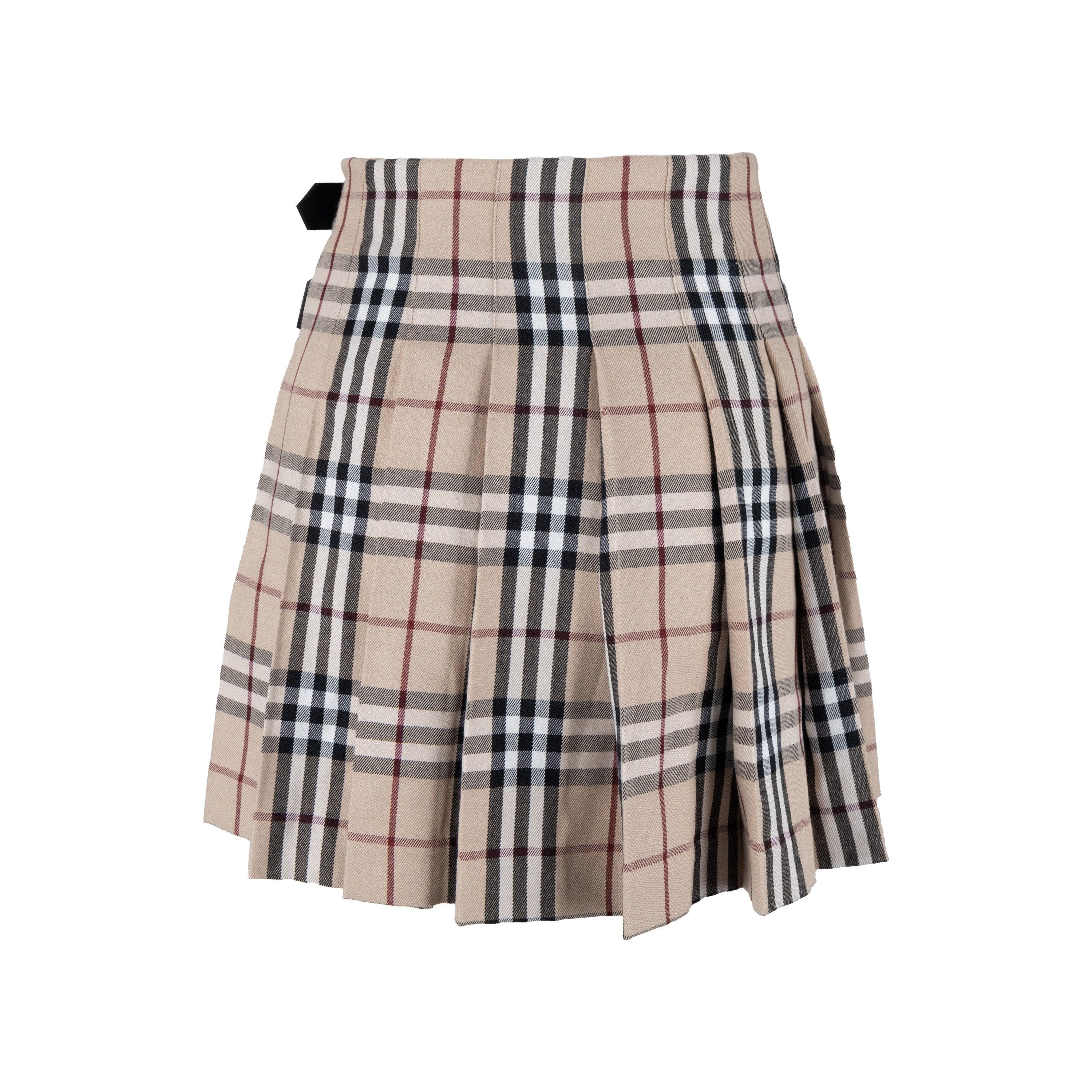 This Burberry Pleated Mini Skirt is expertly crafted with 100% wool. Featuring the signature Burberry plaid print in beige, this mini skirt has a pleated wrap style with an adjustable buckled leather belt. Ideal for a chic look, paired with boots. 
