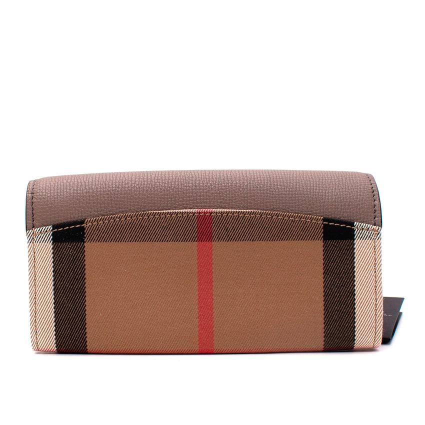 Burberry Porter Taupe Leather & House Check Canvas Long Wallet

- Flap wallet in contrasting House Check canvas and taupe grained leather
- Burberry signature on the flap
- Interior card slots and change compartments

Materials: Leather and