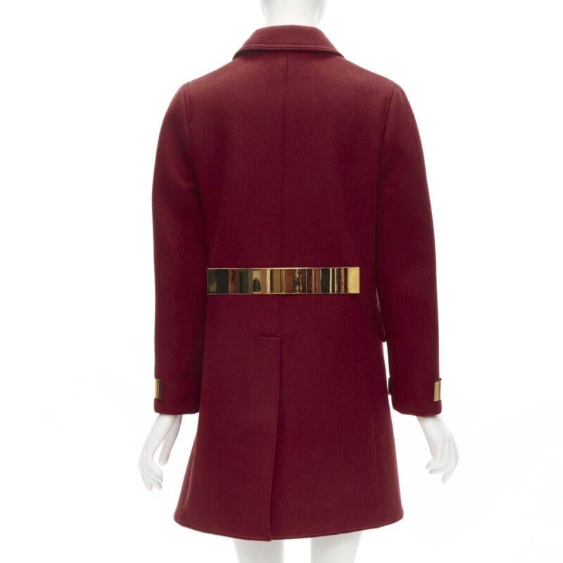 BURBERRY PROPRSUM 90% cashmere blend red gold metal bar coat IT38 XS
Reference: KNLM/A00068
Brand: Burberry
Designer: Christopher Bailey
Material: Cashmere, Blend
Color: Red, Gold
Pattern: Solid
Closure: Button
Lining:  Viscose
Extra Details: 90%