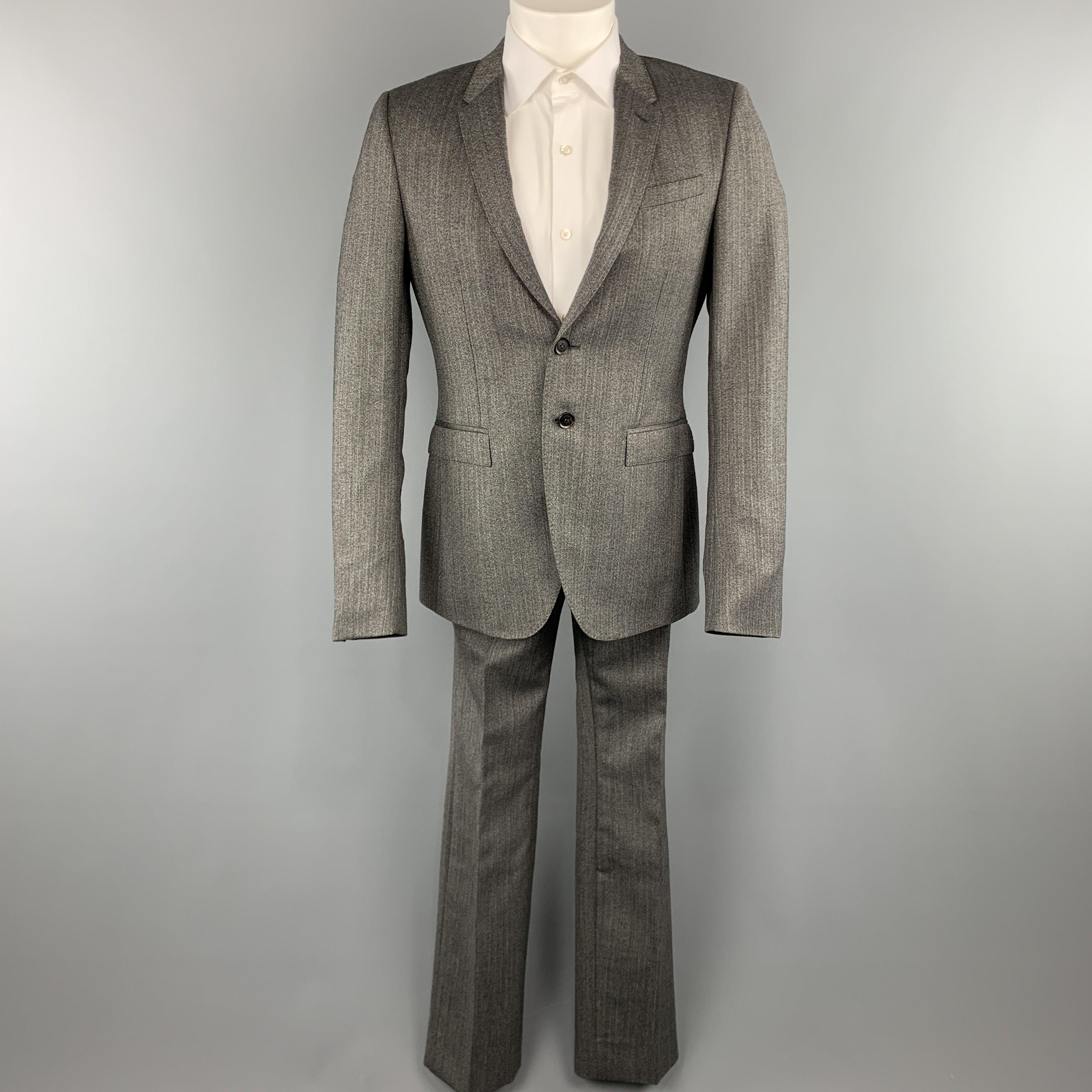 BURBERRY PRORSUM suit comes in a grey herringbone and includes a single breasted, two button sport coat with notch lapel and matching front trousers.
Excellent Pre-Owned Condition. 

Marked:   50 

Measurements: 
  -JacketShoulder: 16.5 inches