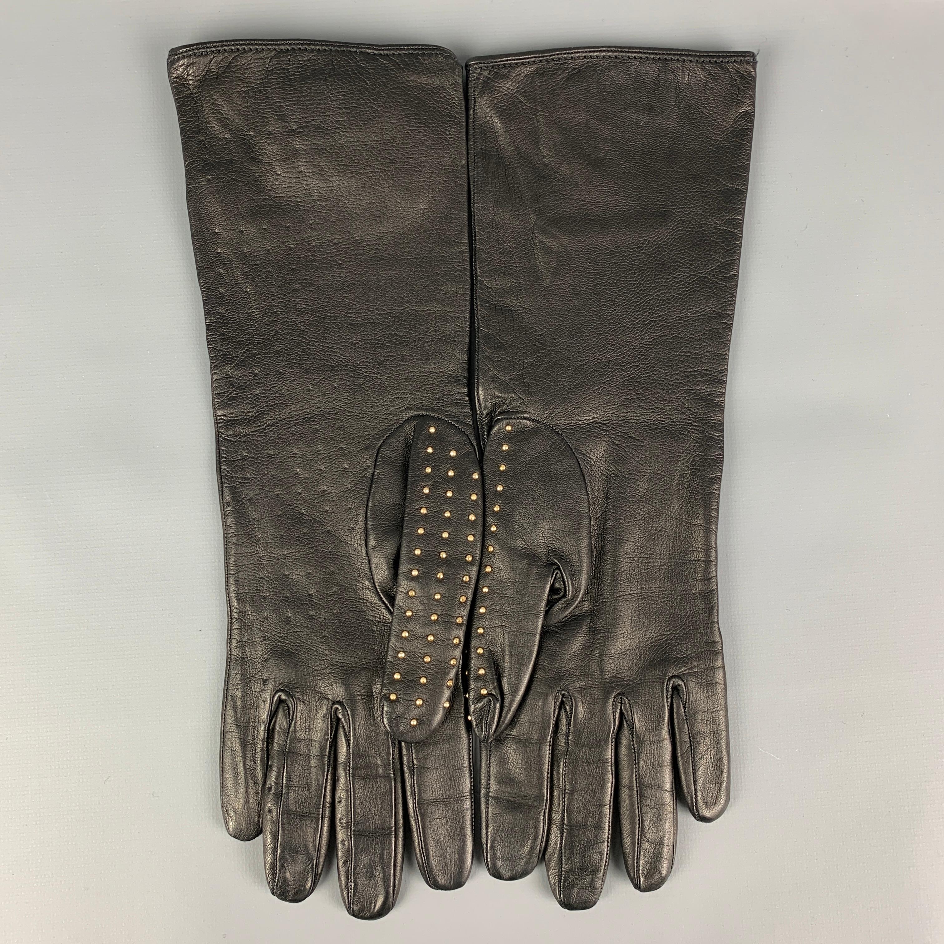 BURBERRY PRORSUM gloves comes in a black kidskin leather with a silk lining featuring gold tone studded details. Made in Italy. 

New With Tags. 
Marked: 7

Measurements:

Width: 4 in.
Length: 12 in.
 