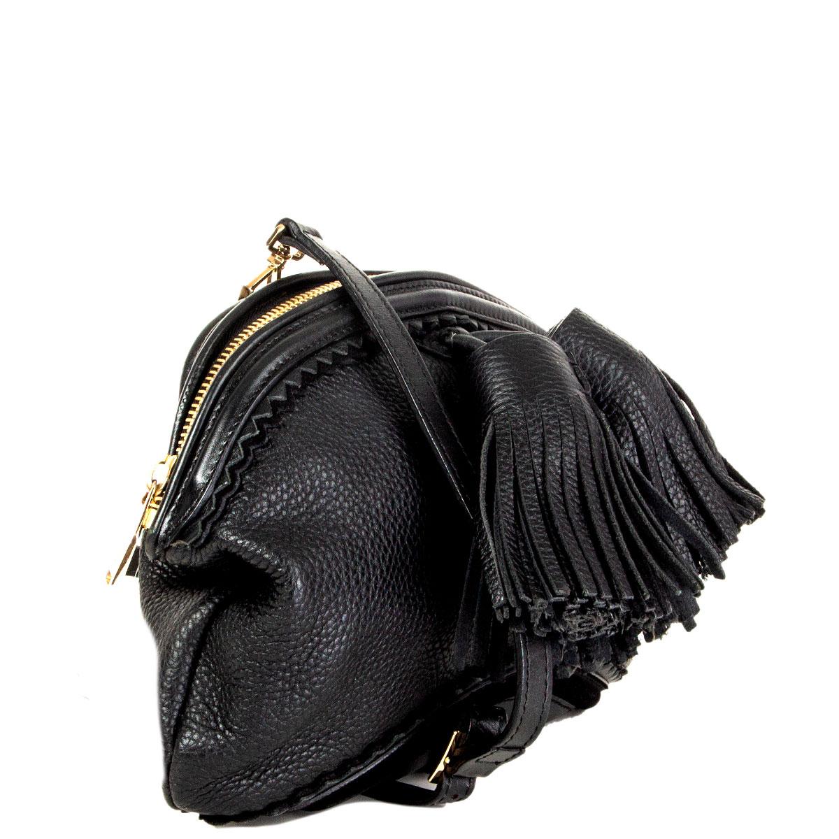 100% authentic Burberry Prorsum Wilbur crossbody bag in black grained calfskin with suede piping and two big tassels at front. Opens with a zipper on top and is lined in black nylon with one zipper pocket against the back and two open pockets