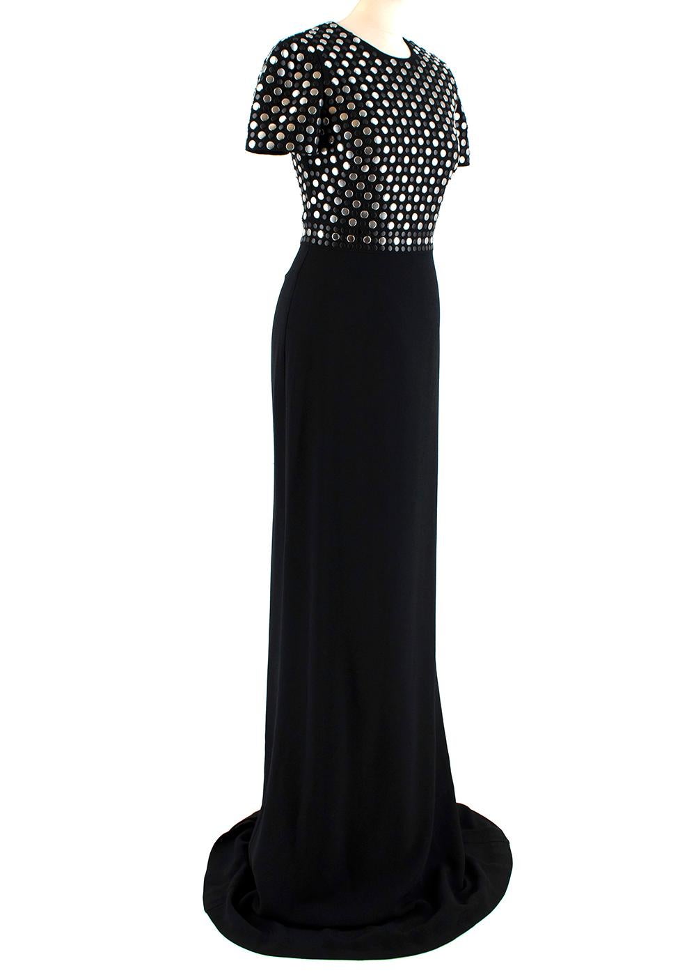 Burberry Black Flat Studded Gown

- Silver tone studs at bodice
- Fully lined
- Back zip closure 
- Heavy weight
- Short sleeved
- Rounded neckline

Materials:
Main:
- 51% Acetate
- 49% Viscose
Lining:
- 95% Viscose
- 5% Elastane
Decorations:
- 100%