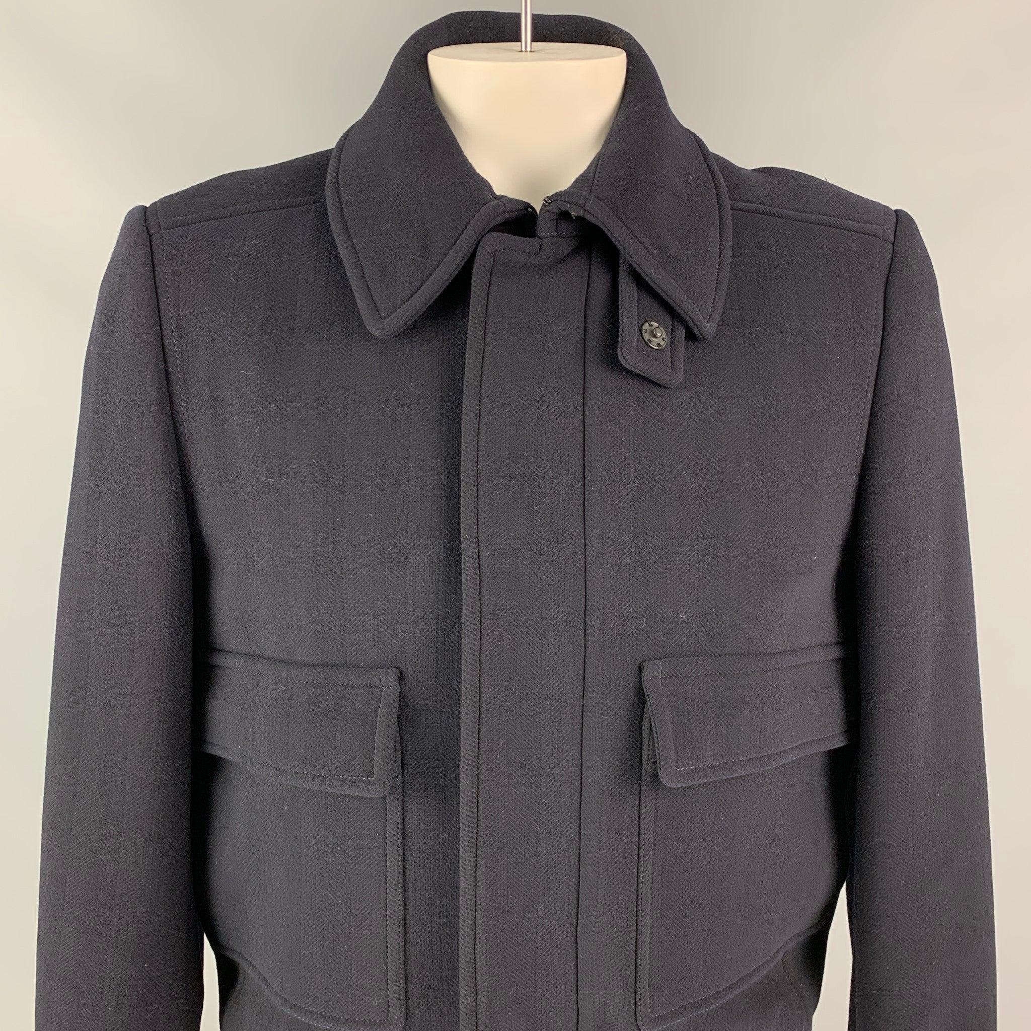 BURBERRY PRORSUM by Christopher Bailey coat comes in a navy virgin wool with a full liner featuring a ribbed hem, spread collar, patch pockets, and a zip & snap button closure. Made in Italy.Very Good
Pre-Owned Condition. 

Marked:  IT 52