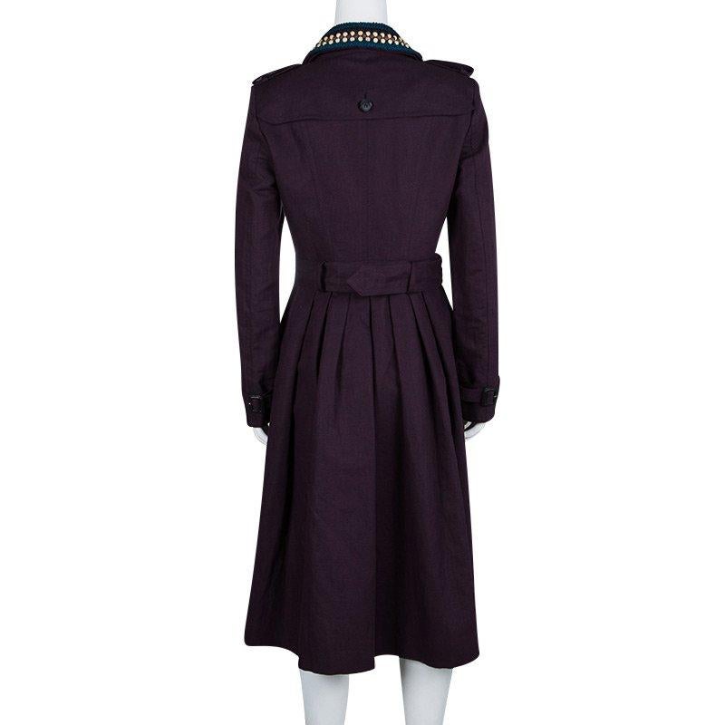 This Burberry Prorsum trench is to die for! The linen blend coat is made to perfection and reflects the brand’s heritage look with a modern twist. The collar has contrast crochet and bead embellishments that grab attention. Cinch your waist with the
