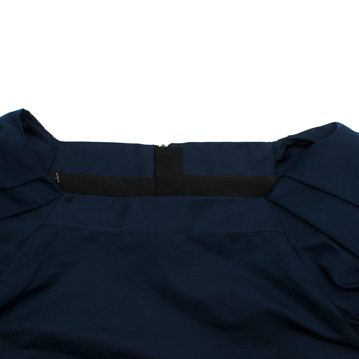Burberry Prorsum Dark Blue Puff Sleeve Dress 

-Dark blue colour
-Short puffed sleeves
-Concealed back zip closure
-Straight neckline 

Please note, these items are pre-owned and may show some signs of storage, even when unworn and unused. This is