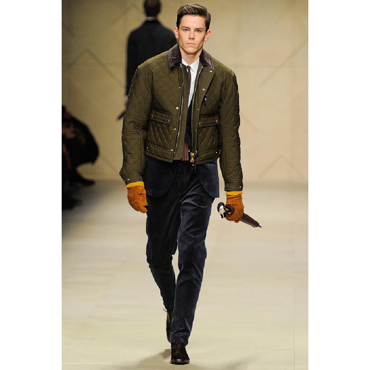 BURBERRY PRORSUM F/W 2012 Riding Jacket comes in an olive quilted waxed cotton material, featuring a contrast brown corduroy collar, gold tone metal snaps and zipper at closure, patch pockets, a leather trim and waist straps at side. Made in