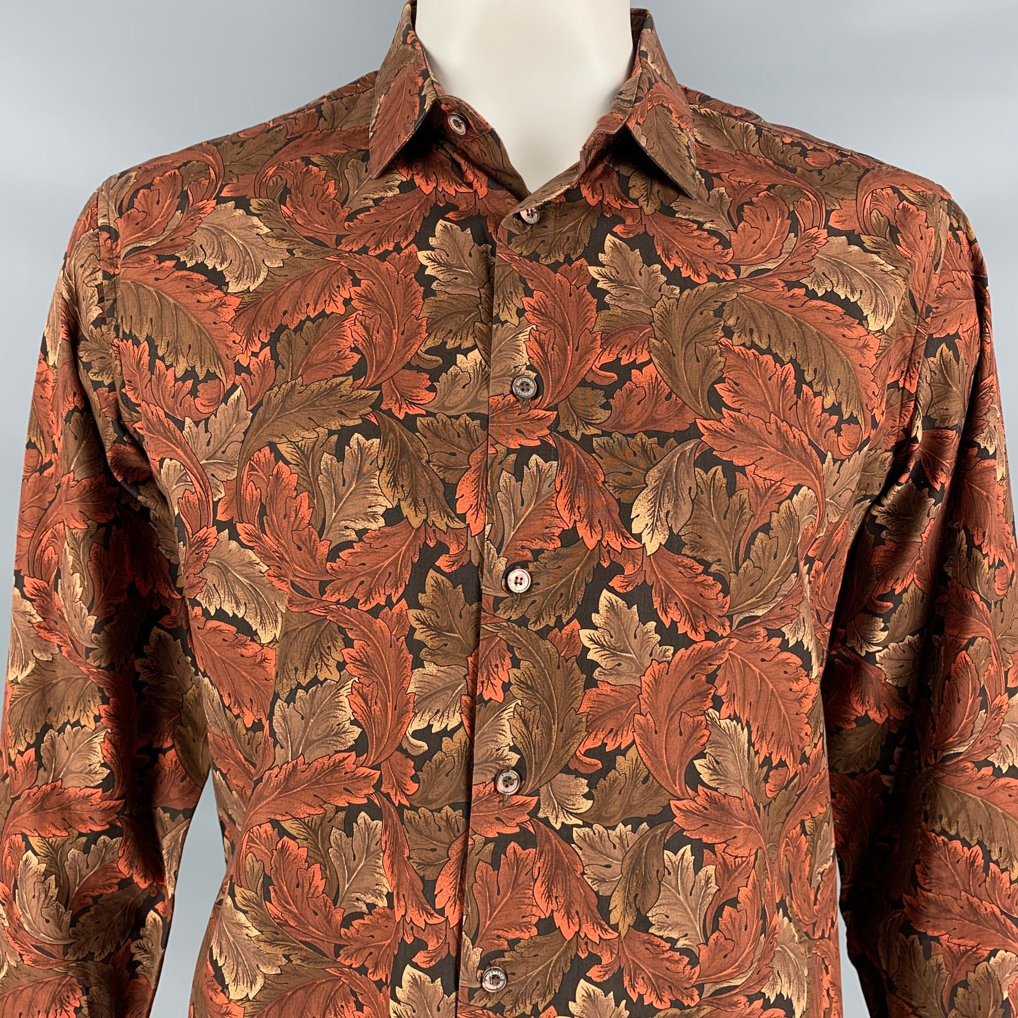 BURBERRY PRORSUM Fall 2008 long sleeve shirt comes in a brown & black leaf print cotton featuring a spread collar and a button up closure. Made in Italy.

Very Good Pre-Owned Condition.
Marked: 42/16.5

Measurements:

Shoulder: 19.5 in.
Chest: 46