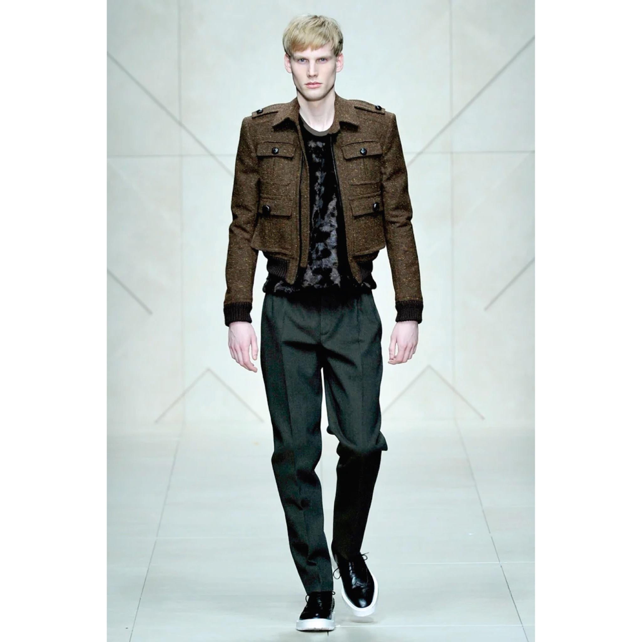 BURBERRY PRORSUM Fall 2011 Military Inspired jacket comes in a brown tweed wool with a black quilted liner featuring a ribbed hem, patch pockets, epaulettes, and a zip up closure. Made in Italy.

Excellent Pre-Owned Condition
Marked: IT