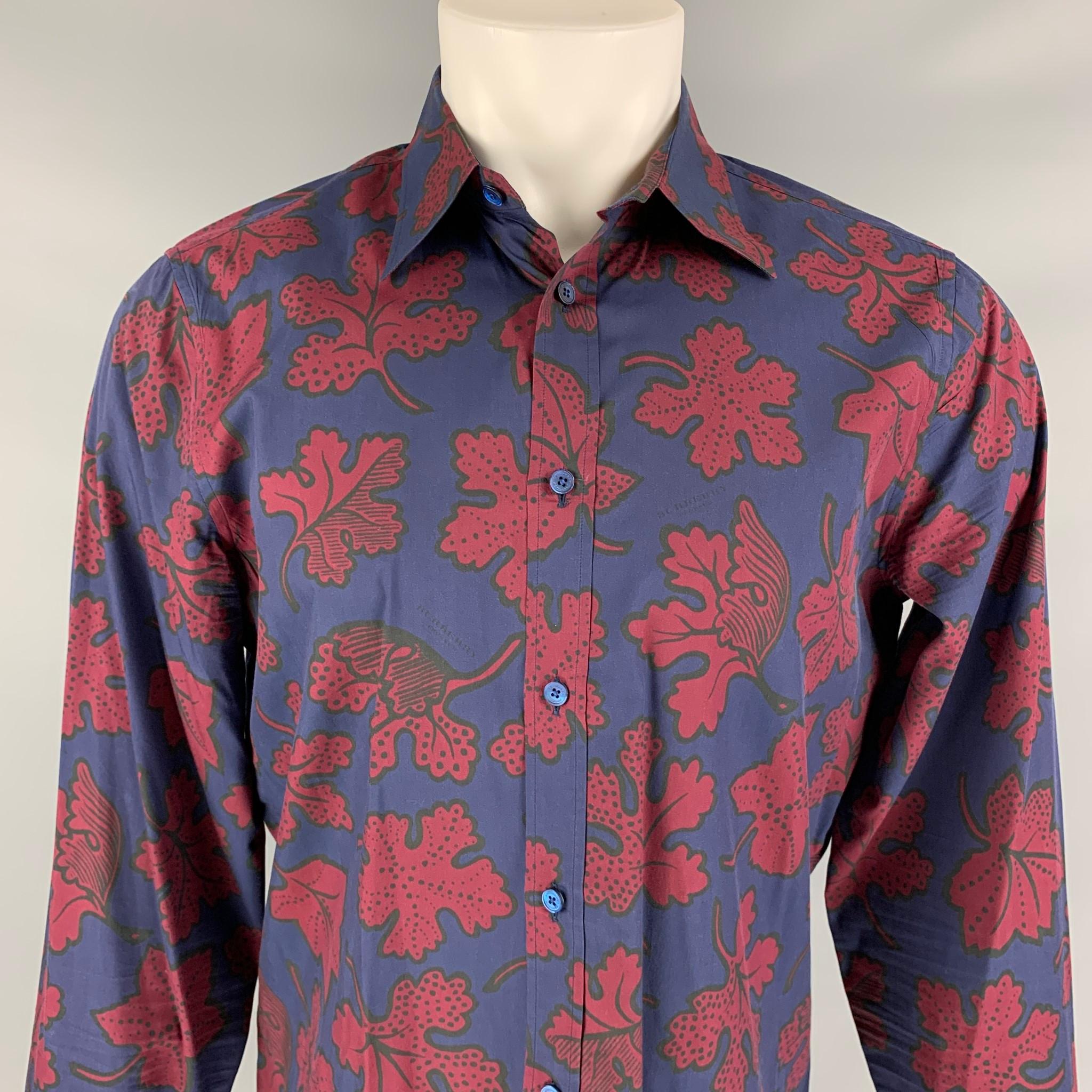 BURBERRY PRORSUM Fall 2014 long sleeve shirt comes in a navy & burgundy leaf print cotton featuring a spread collar and a button up closure. Made in Italy.

Very Good Pre-Owned Condition.
Marked: 15/40

Measurements:

Shoulder: 17.5 in.
Chest: 42
