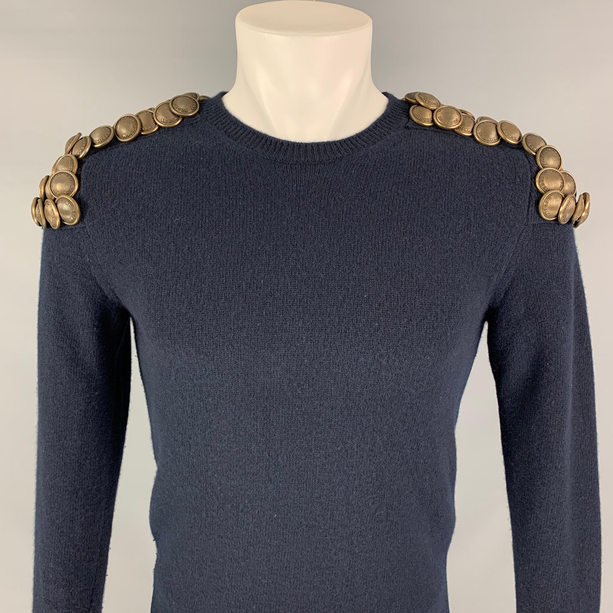 BURBERRY PRORSUM Iconic Fall 2010 Collection sweater comes in a navy knitted wool featuring a military inspired design with shoulder gold tone button epaulettes and a ribbed crew-neck. Made in Italy.

Excellent Pre-Owned Condition.
Marked:
