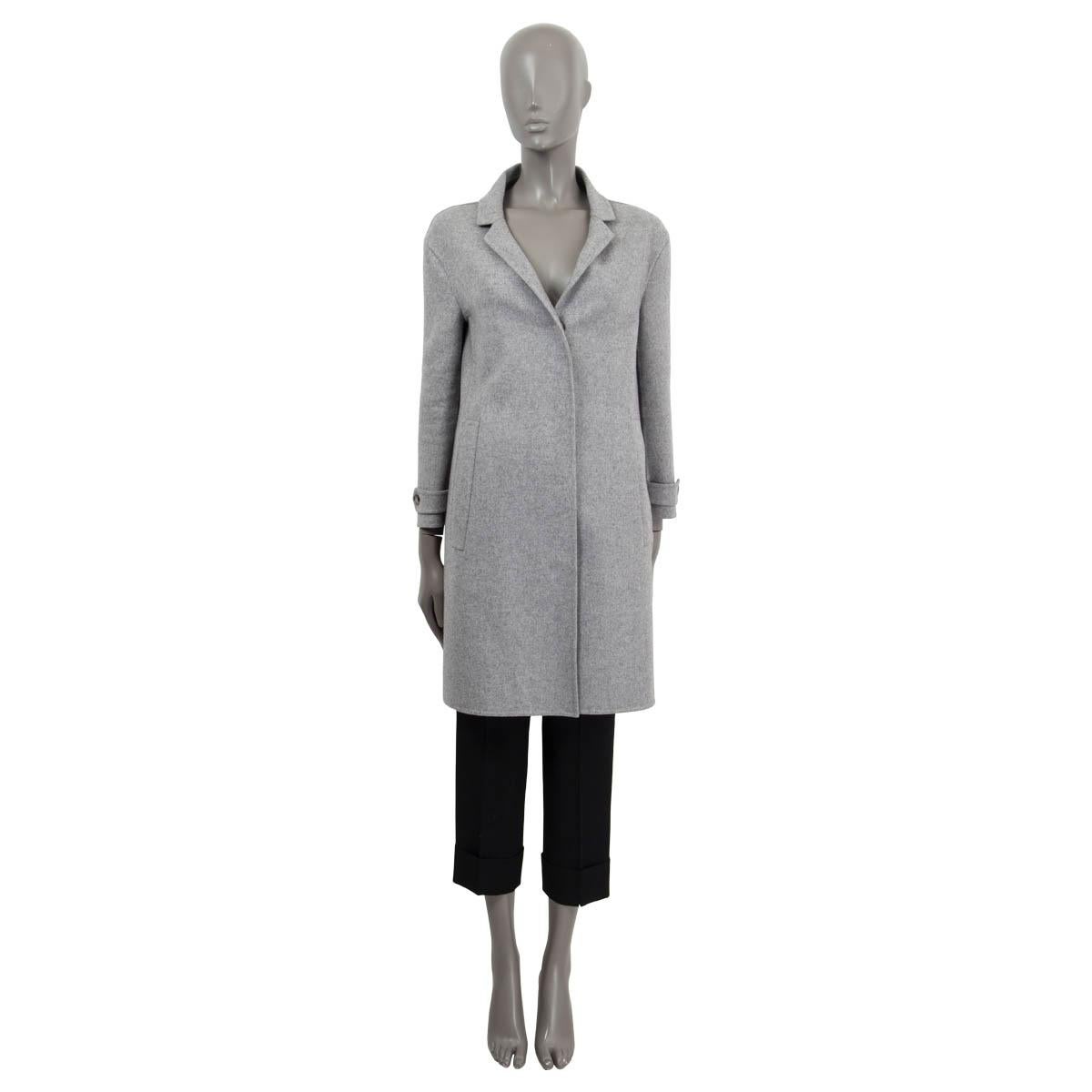 100% authentic Burberry A-Line coat in gray cashmere (100%). Features 7/8 sleeves, two slit pockets on the front and a slit on the back. Opens with four buttons on the front. Unlined. Has been worn and is in excellent condition.

2014