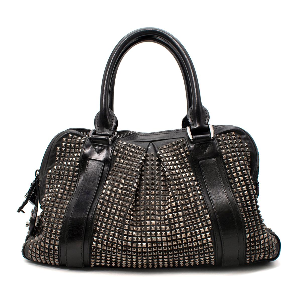 Burberry Prorsum Knight Black Leather Silver Studded Tote Bag

- Large, black leather duffle-style tote bag with all-over small silver-tone metal studs
- 2 rolled black leather top handles
- Zip opening, and padlock detail in silver-tone metal
-