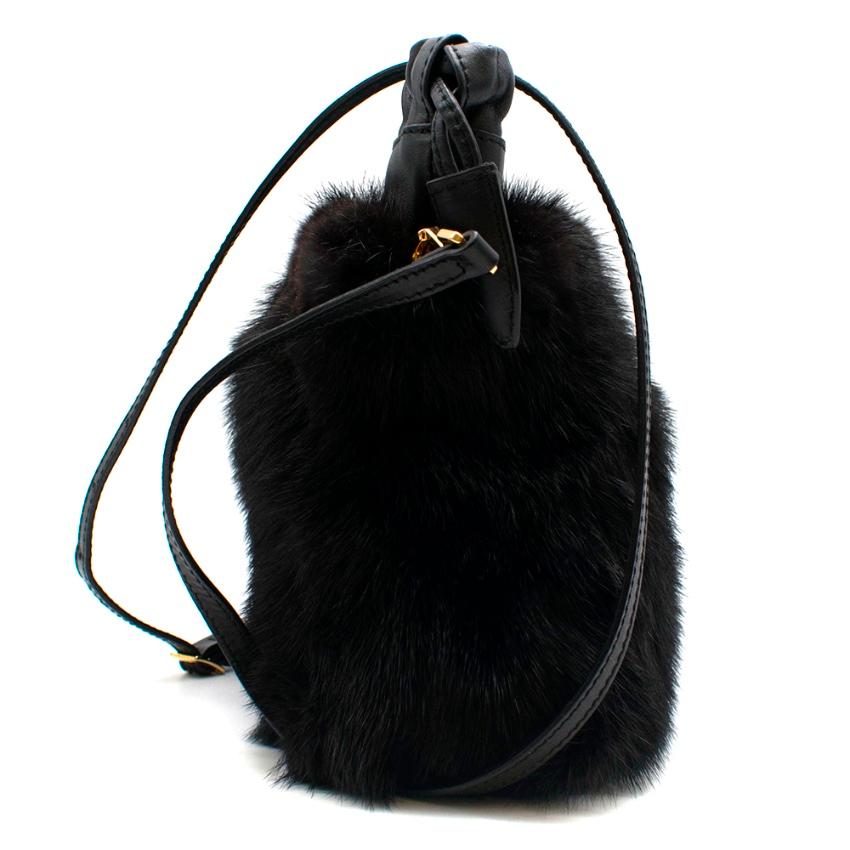 Burberry Prorsum Little Crush in Mink with Metal Heart Shoulder Bag 

- Detachable and adjustable shoulder strap 
- Polished metal lock 
- Inner Zip Pocket and two Slip Pickets 
- Magnetic Clasp Closure 
- Drawstring Top Closure 
- Mink Fur with