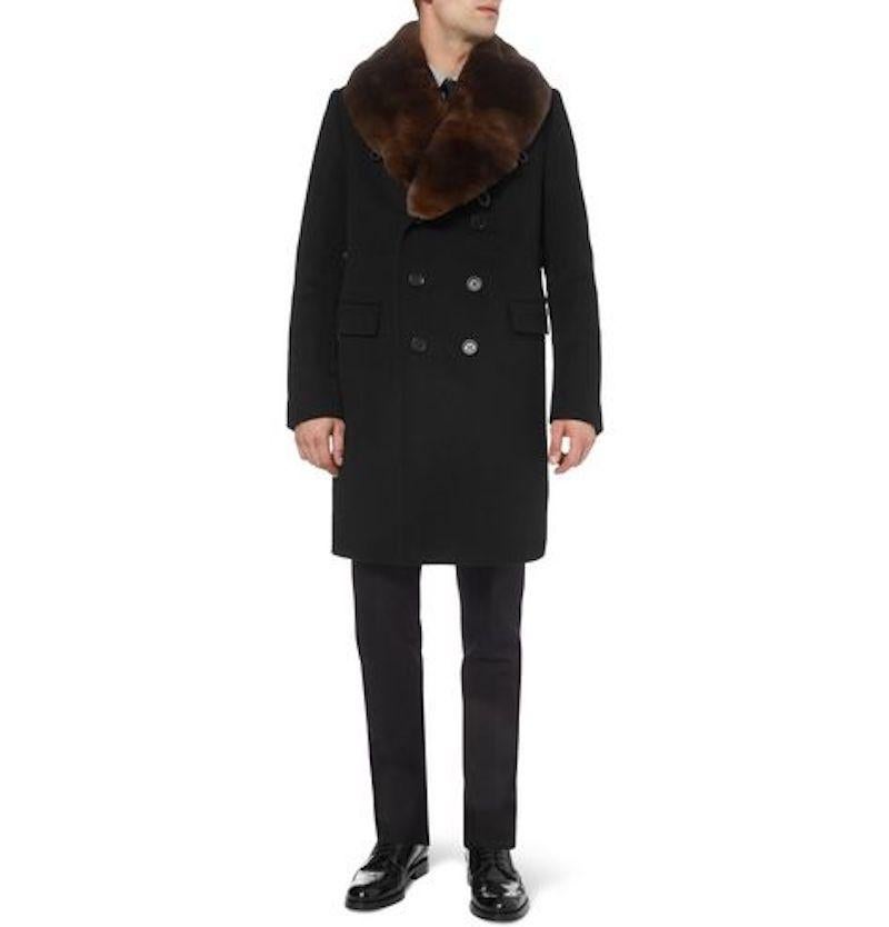 From Christopher Bailey's tenure at Burberry. We present this stunning, iconic, heavy weight Men's BURBERRY PRORSUM winter over coat comes in a 100% black virgin wool with a double breasted button front, brown rabbit fur detachable collar, and