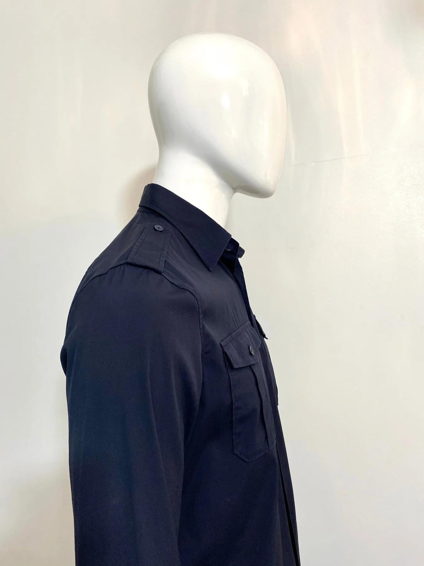 Burberry Prorsum Military Shirt

Navy blue cotton with epaulettes at the shoulders. Chest button closure flap pockets. Button closure and cuffs with signature buttons. No composition label but corresponds to cotton.

Additional information:
Size –