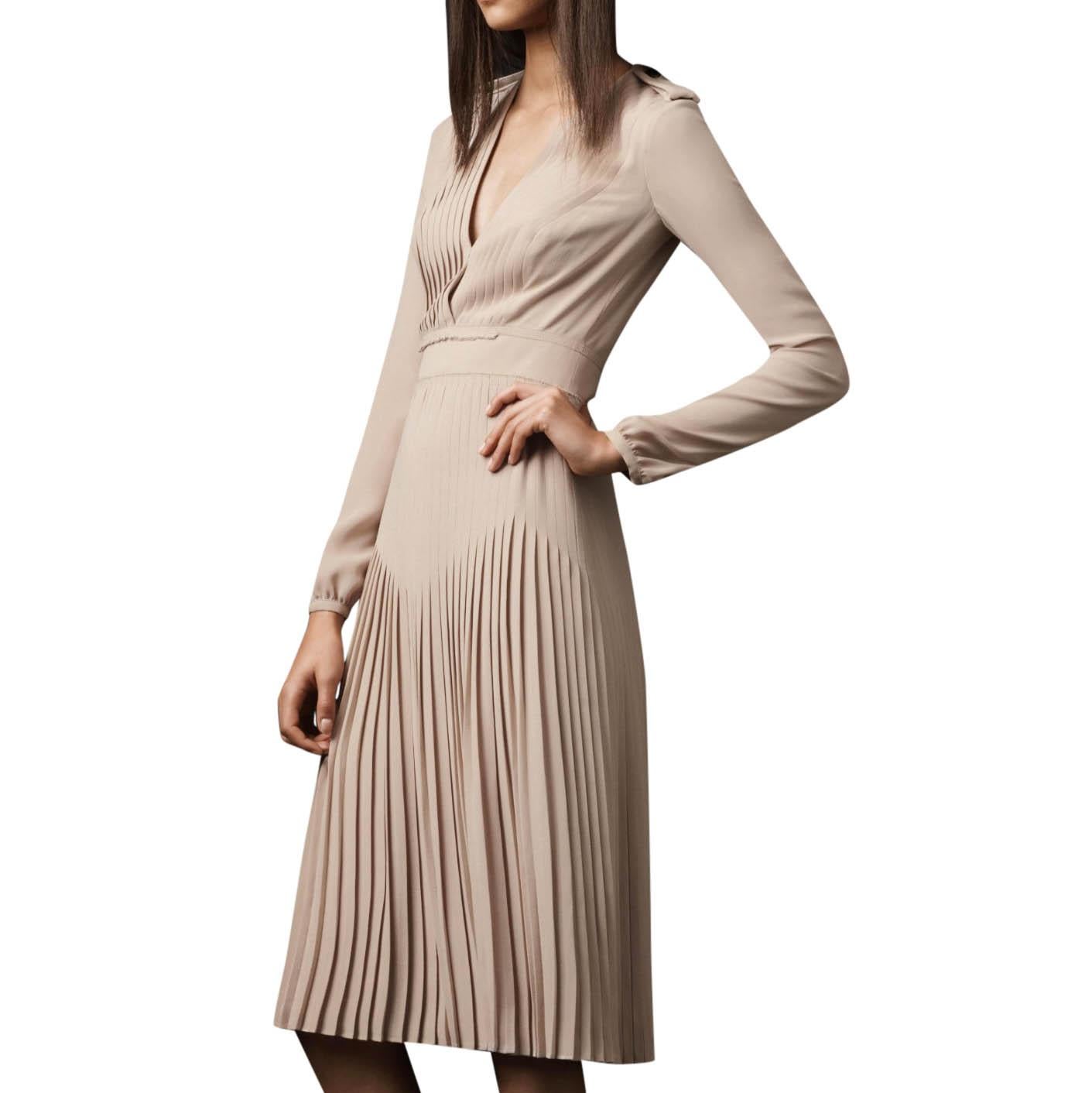 Burberry Prorsum Pleated Silk V-Neck Dress 

-Nude, mid-weight silk
-Lined
-Deep v-neck
-Back keyhole
-Back centre zip fastening
-Bishop long sleeves 
-Pleated skirt 
-Waist panneling detail 
-Shoulder epaulettes
- 100% Silk

Approx.
Measurements