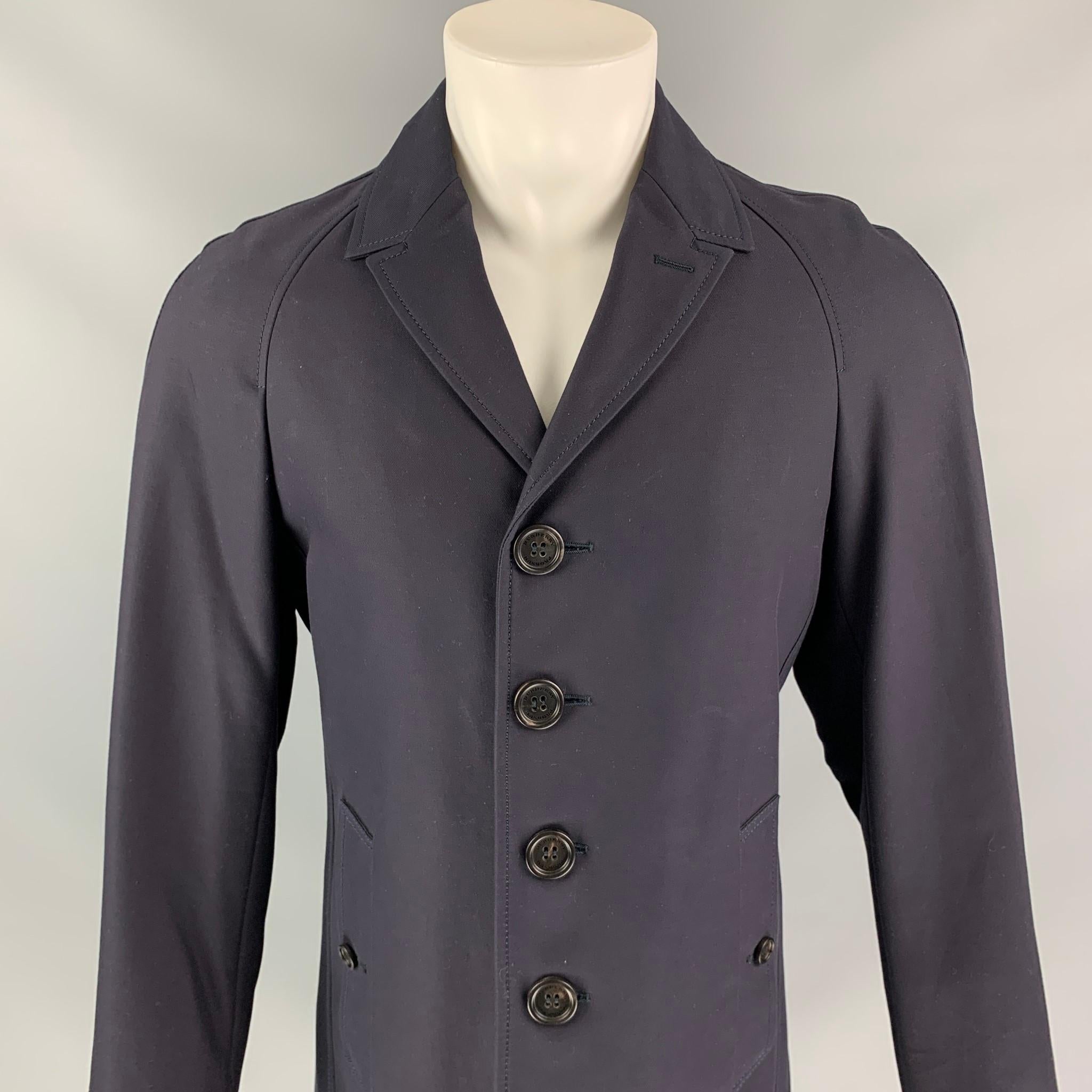 Burberry Prorsum Pre-Fall 2013 Navy Blue Overcoat by Christopher Bailey, lightweight, logo lining, collar, slit pockets and four button closure. Made in Italy.

Very Good Condition. Light wear.
Marked:  M  US38, IT48

Measurements:

Chest: 38