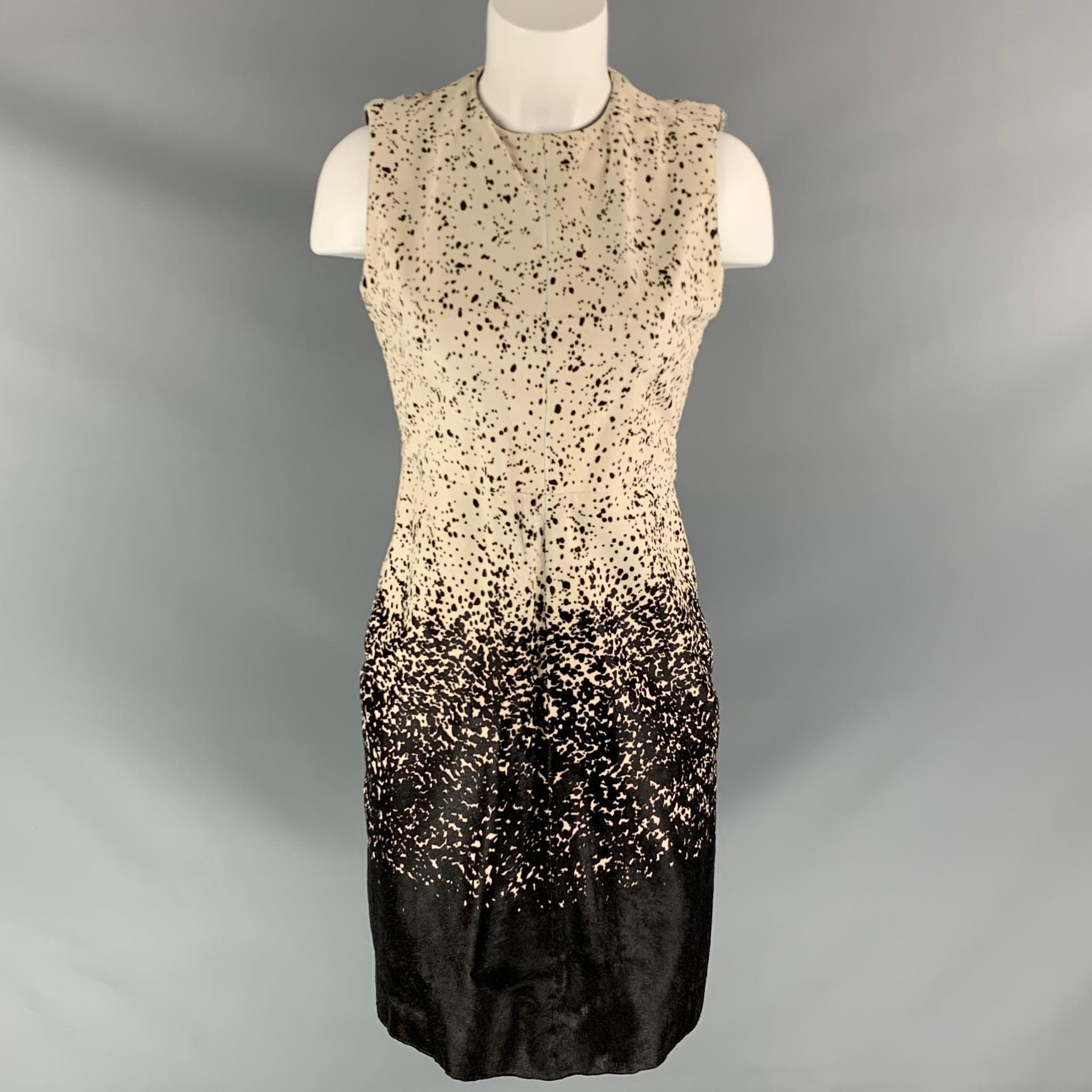 Burberry Prorsum Pre-Fall 2013 Printed Mini Dress by Christopher Bailey. Brown and ivory with splatter print throughout, crew neck and concealed zip closure at back.

Excellent Pre-Owned Condition.
Marked: 40

Bust: 34