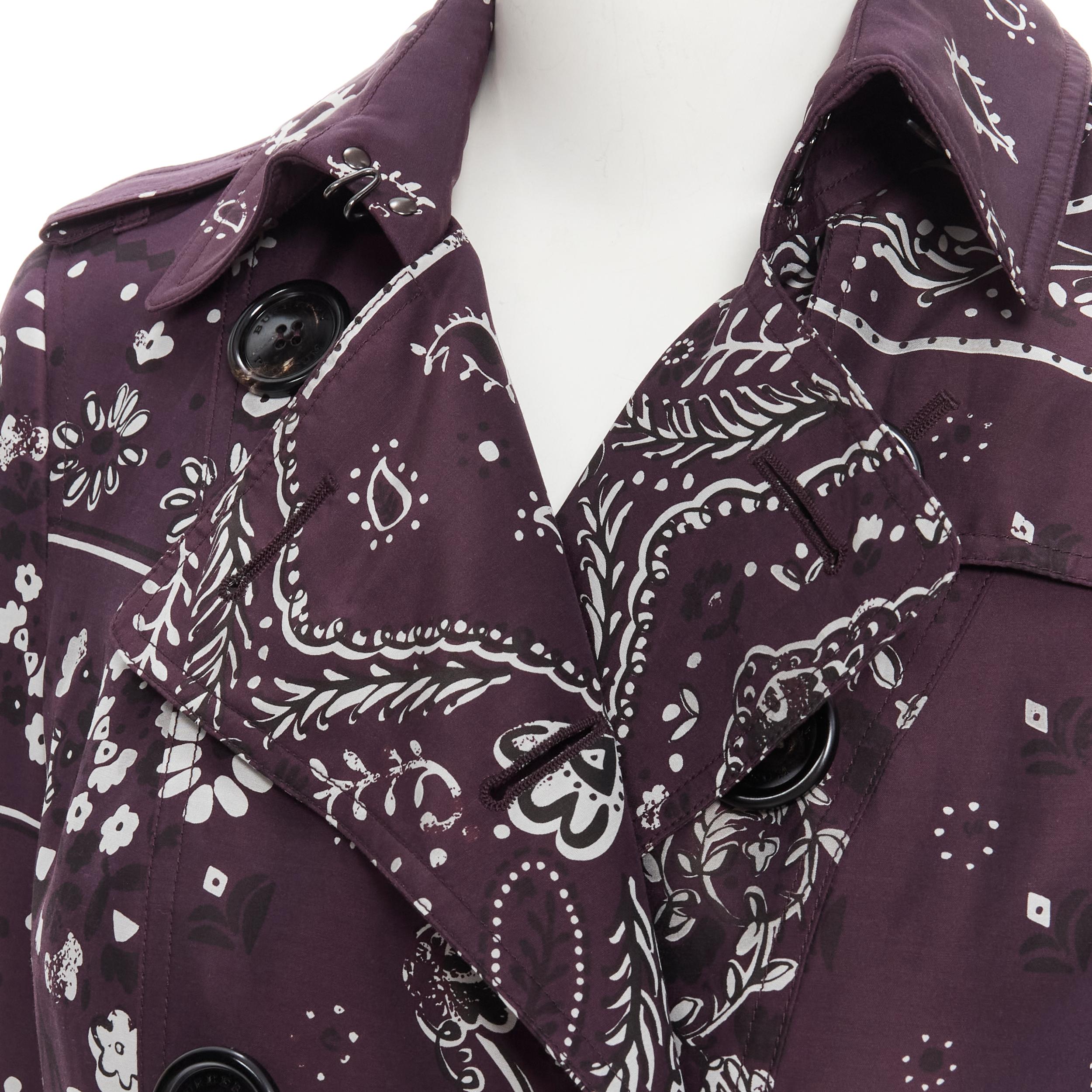 BURBERRY PRORSUM purple paisley bandana silk blend double breasted trench UK6 XS 
Reference: TGAS/B01277 
Brand: Burberry Prorsum 
Designer: Christopher Bailey 
Material: Silk 
Color: Purple 
Pattern: Paisley 
Closure: Button 
Extra Detail: Paisley