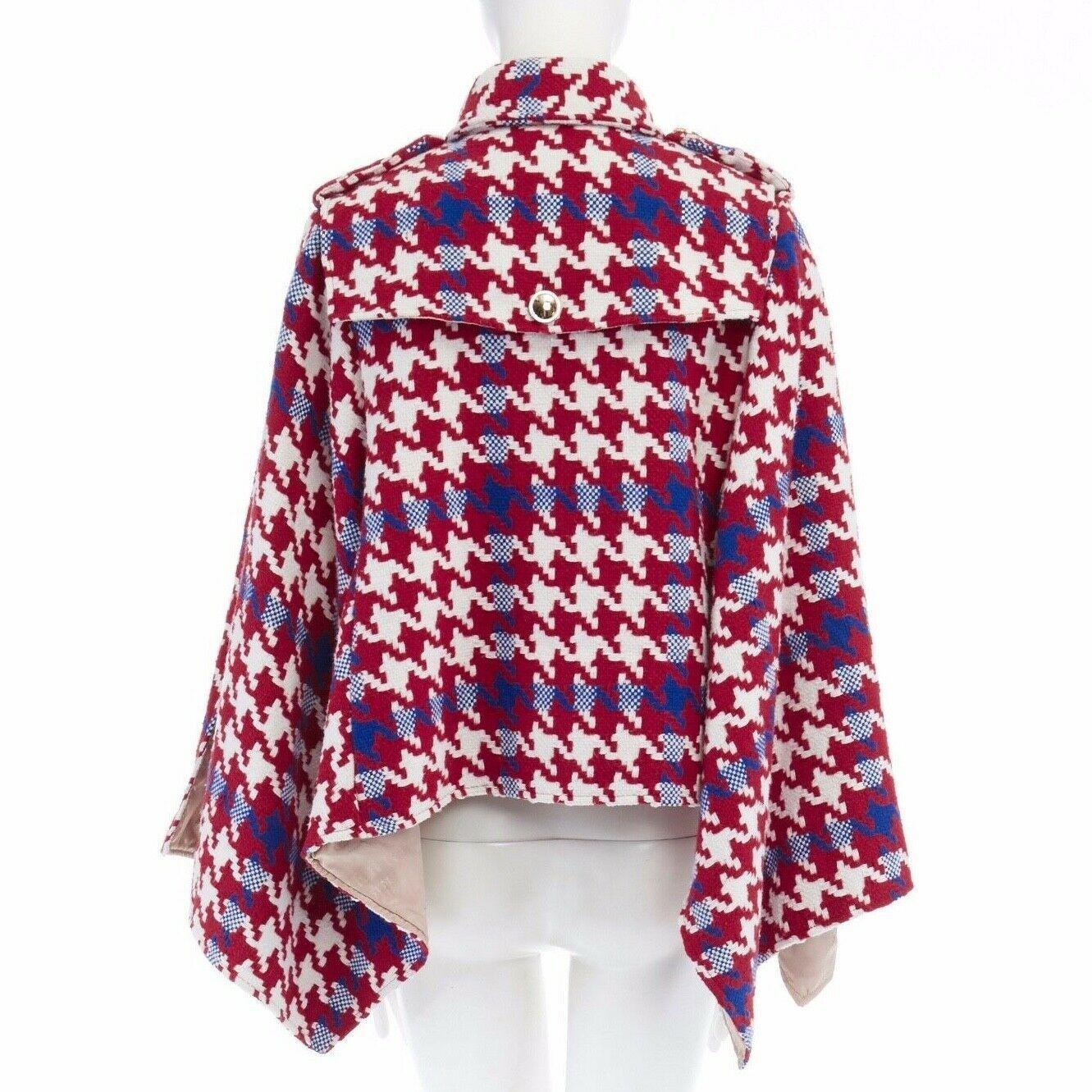 BURBERRY PRORSUM red blue houndstooth wool double breasted poncho cape jacket M

BURBERRY PRORSUM
Wool, polyester . Red, blue and white oversized houndstooth wool knitted upper . Double breasted front closure .Mirrored gold button front . Spread