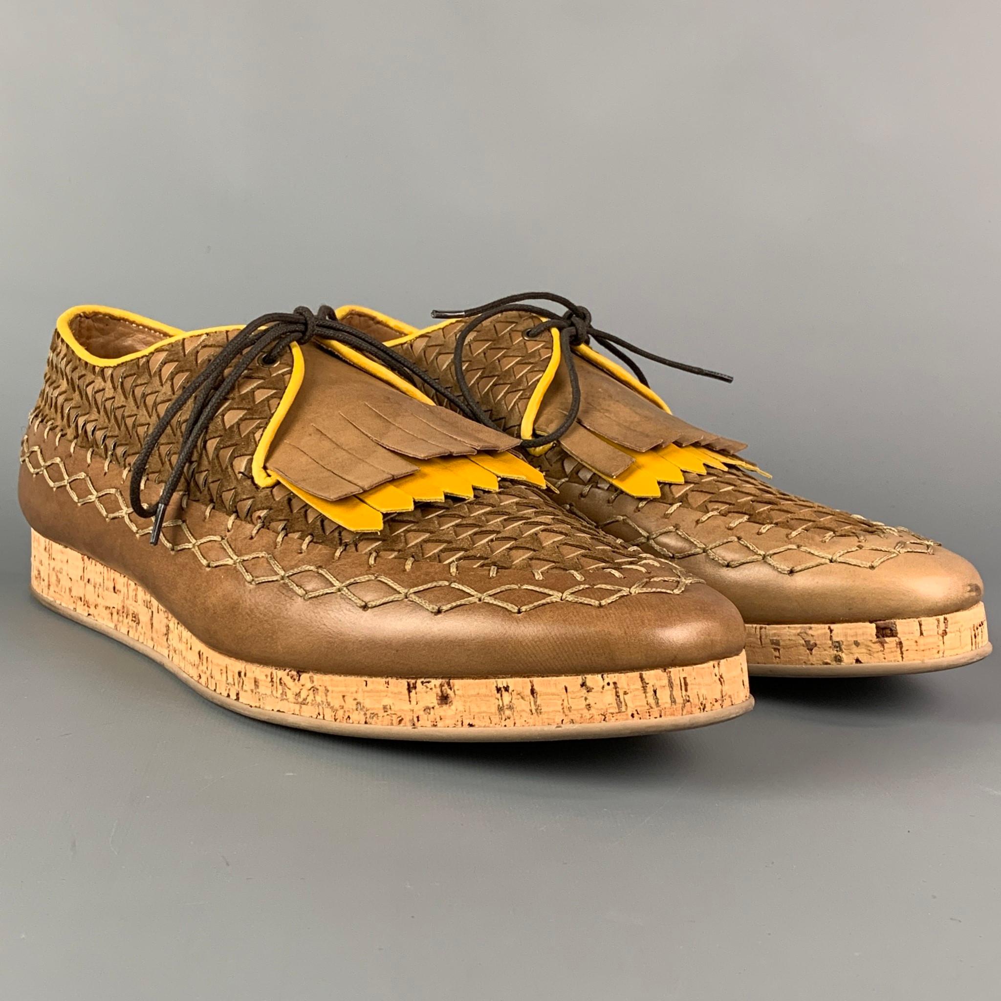 BURBERRY PRORSUM 'Arundel Mocassin' shoes comes in a brown leather with a yellow trim featuring stitched details, lace up, and a cork sole. Made in Italy. Includes box. 

Excellent Pre-Owned Condition.
Marked: 45
Original Retail Price: