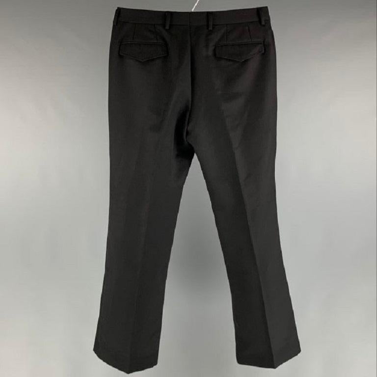 BURBERRY PRORSUM dress pants comes in a black wool woven featuring a flat front, welt pockets, and a zip fly closure. Very Good Pre-Owned Condition. Altered. Fabric Tags Removed. 

Marked:  32 

Measurements: 
 Waist: 32 inches Rise: 9 inches
