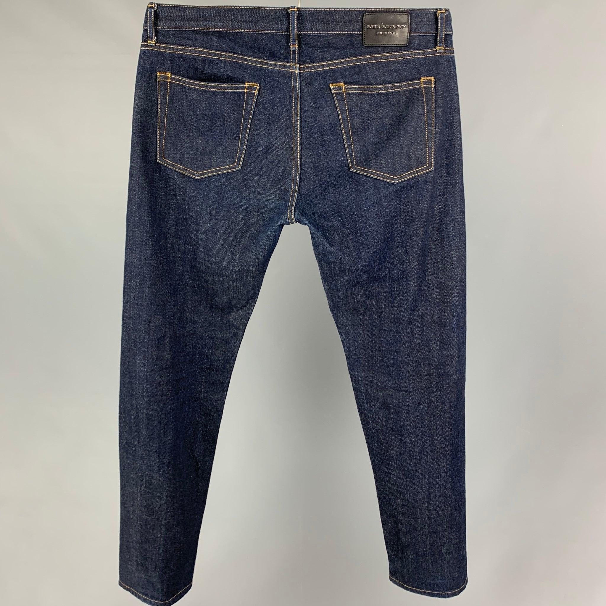 BURBERRY PRORSUM by Christopher Bailey jeans comes in a indigo blue denim featuring a slim fit, contrast stitching, and a button fly closure.
Very Good
Pre-Owned Condition. 

Marked:   32 

Measurements: 
  Waist: 32 inches Rise:
8.5 inches  Inseam: