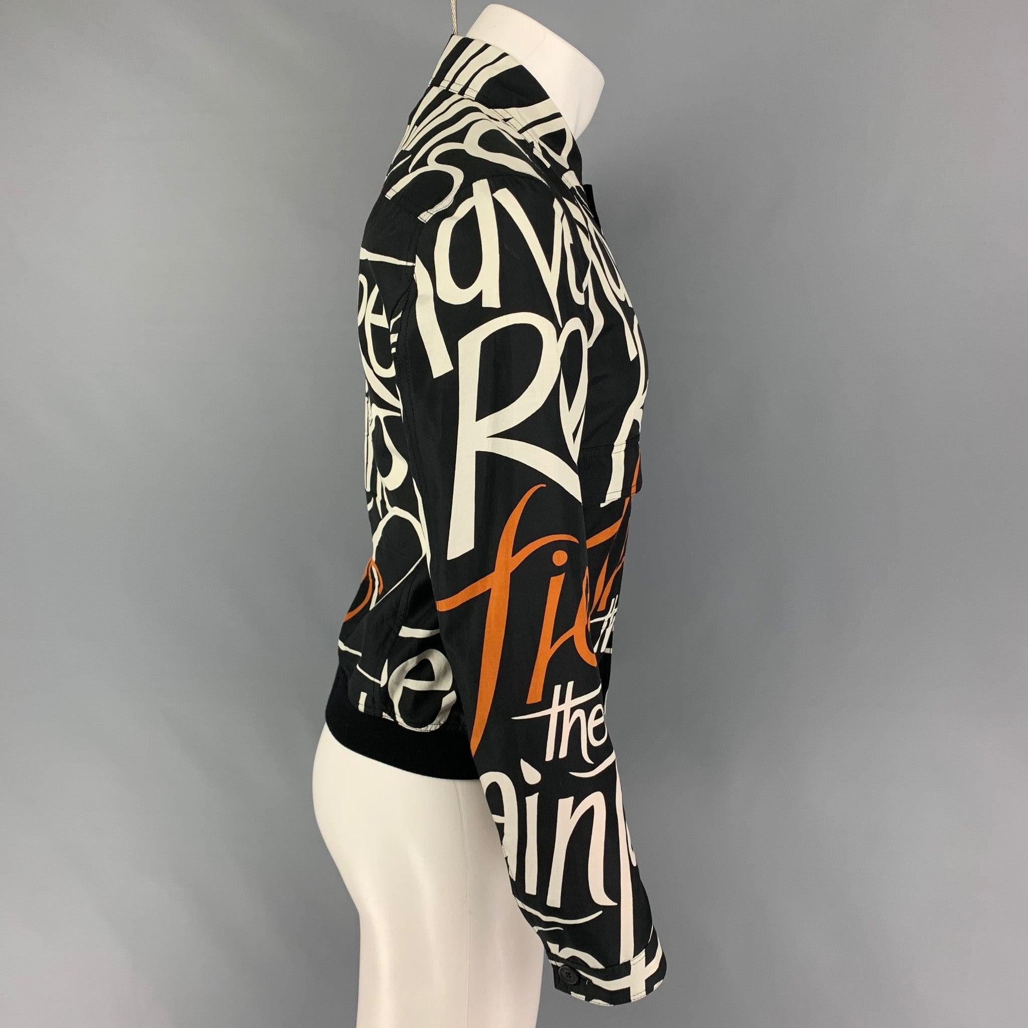 BURBERRY PRORSUM by Christopher Bailey jacket comes in a black & copper silk blend with a graphic print throughout featuring a ribbed hem, flap pockets, spread collar, and a full zip up closure. Made in Italy.
Very Good Pre-Owned Condition. Light
