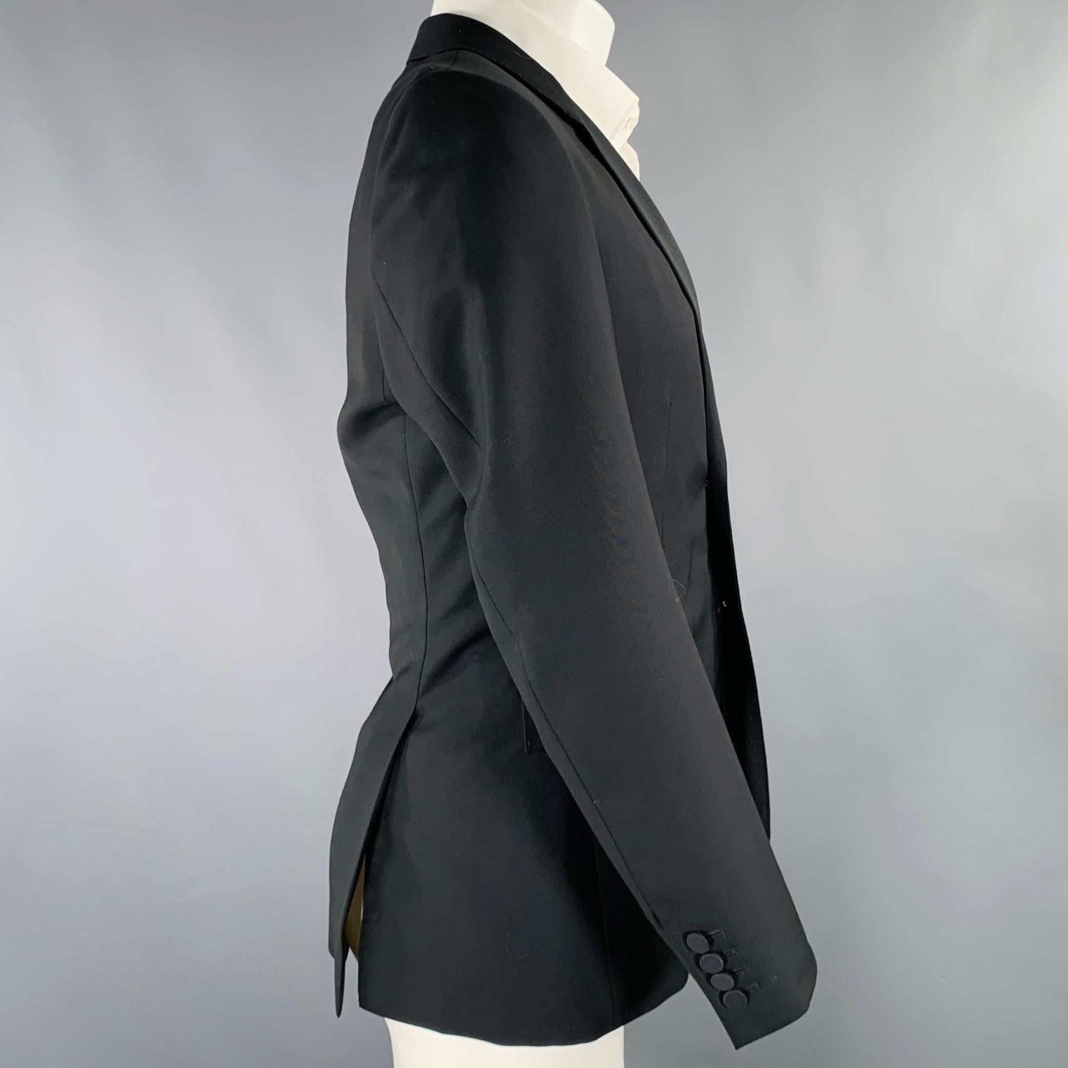 BURBERRY PRORSUM sport coat
in a black wool fabric featuring a notch lapel, double vented back, and double button closure. Made in Italy.Excellent Pre-Owned Condition. 

Marked:   48 

Measurements: 
 
Shoulder: 16.5 inches Chest: 38 inches Sleeve: