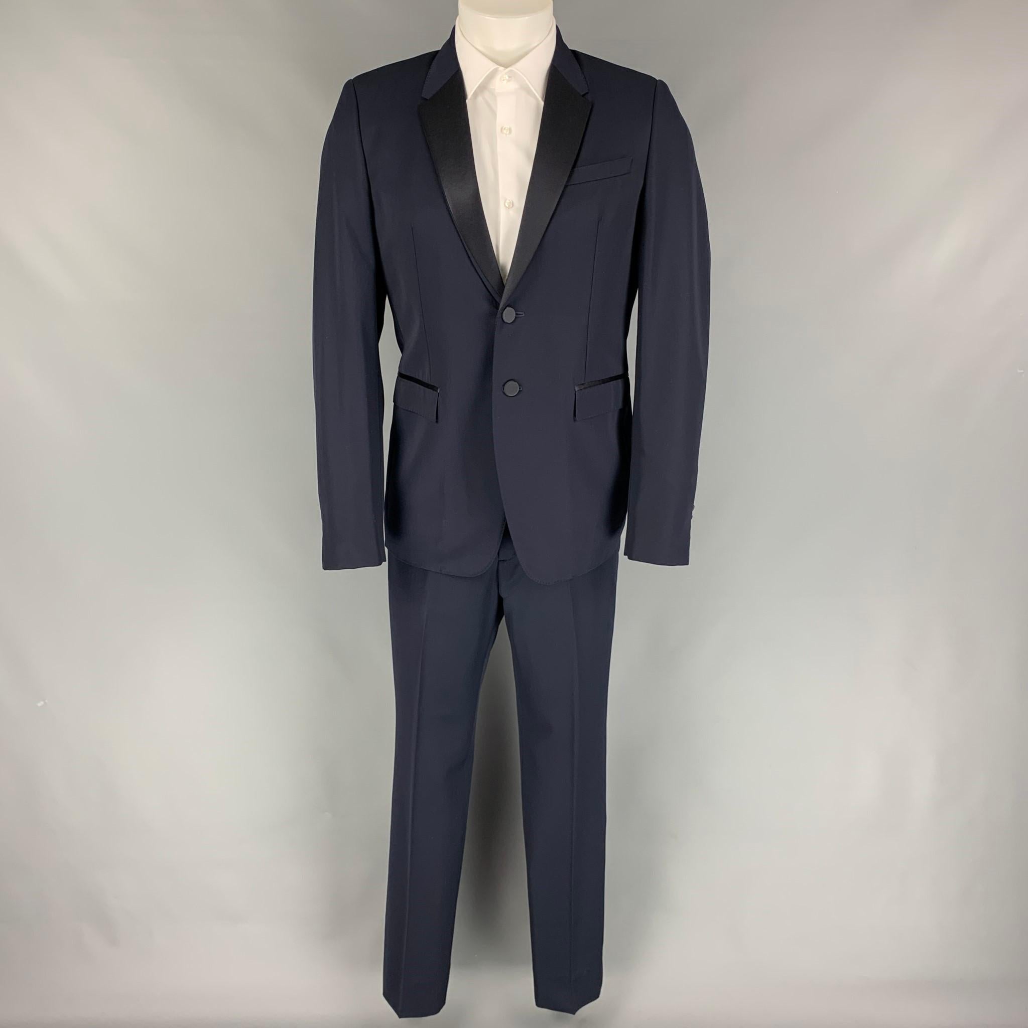 BURBERRY PRORSUM tuxedo suit comes in a navy blue virgin wool with a full liner and includes a single breasted, double button sport coat with a notch lapel and matching flat front trousers. Made in Italy.

Excellent Pre-Owned Condition.
Marked: