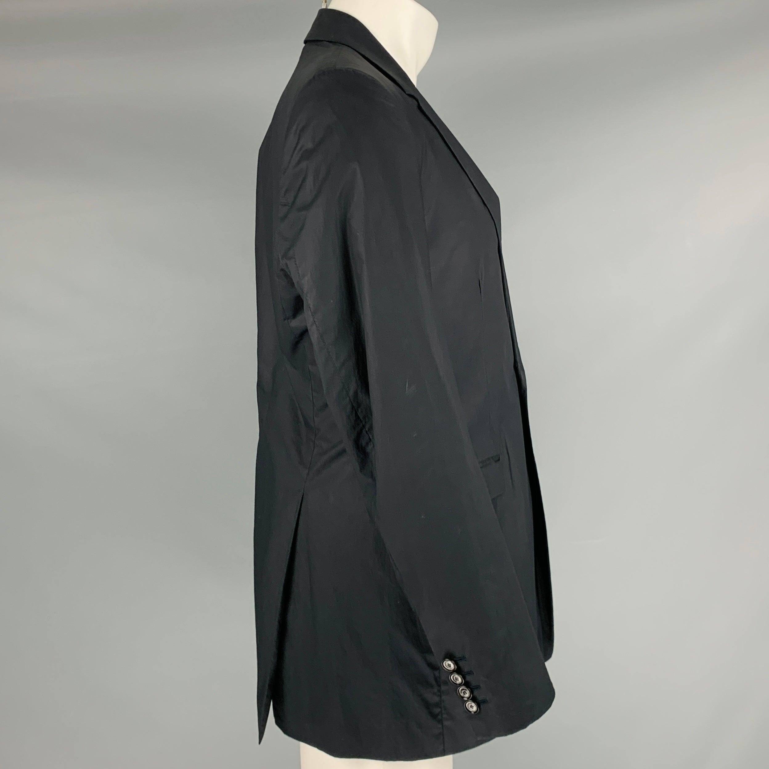 BURBERRY PRORSUM by CHRISTOPHER BAILEY sport coat
in a
black coated cotton fabric featuring notch lapel, double vented back, and double button closure.Very Good Pre-Owned Condition. Moderate marks. 

Marked:   50R 

Measurements: 
 
Shoulder: 16.5