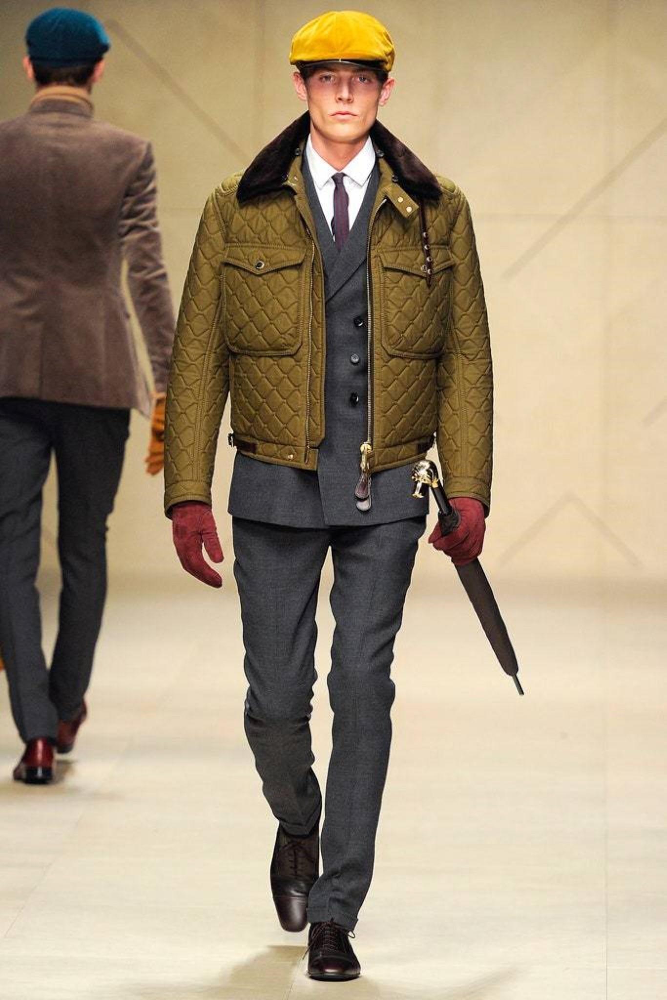Burberry Prorsum Fall 2012 Mink Collar Black Bomber Jacket by Christopher Bailey. Features a blanket-quilted design with detachable mink collar and equestrian leather accents. Distinctive oversized metal luggage details and side-zipped utility